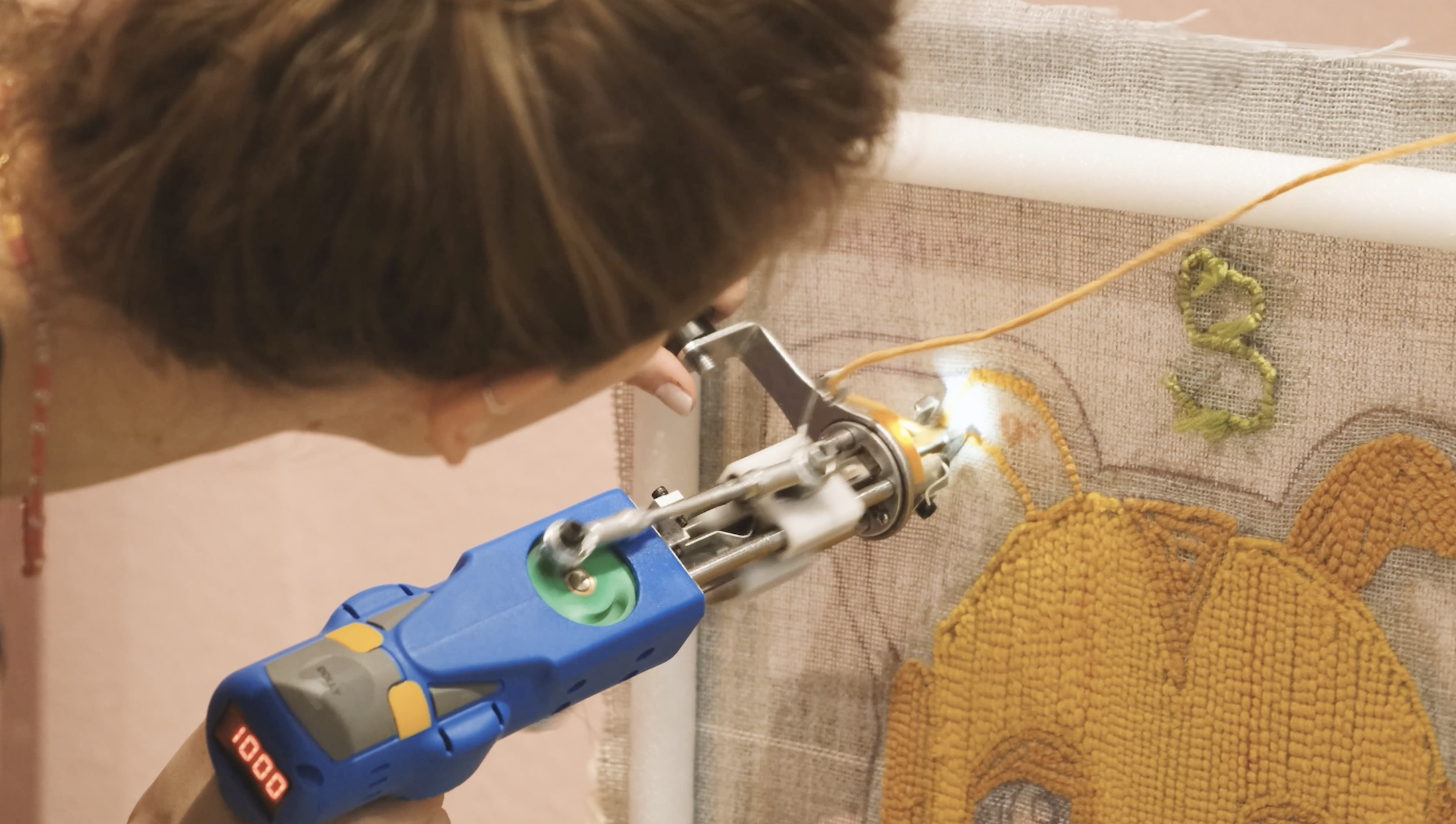 A close up of someone tufting at Tuft Tuft Berlin