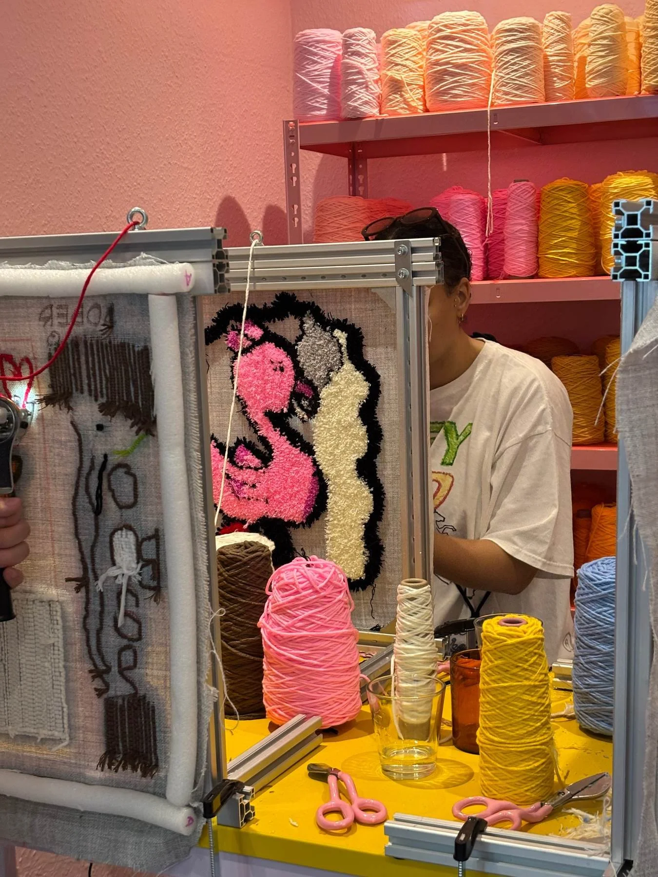 A flamingo inspired rug in a berlin tufting studio
