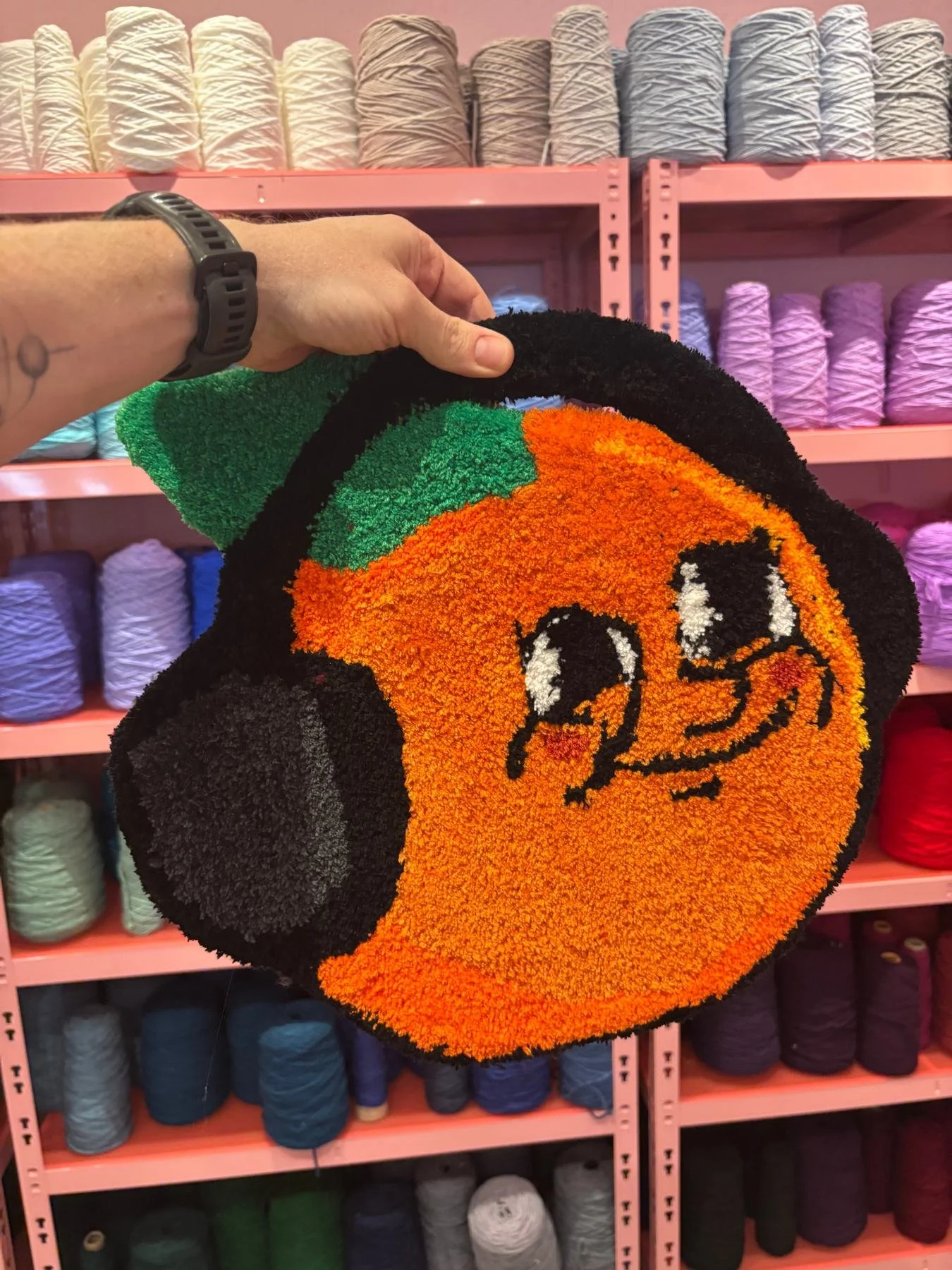 The OG. An orange rug with a cartoon face. 