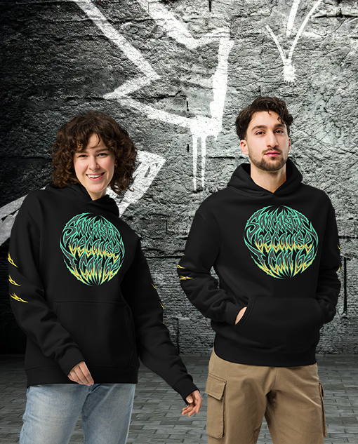 Two young adults, a woman and a man, standing in front of a graffiti-covered brick wall. Both are wearing black hoodies with a colorful, intricate logo on the front and yellow accents on the sleeves.