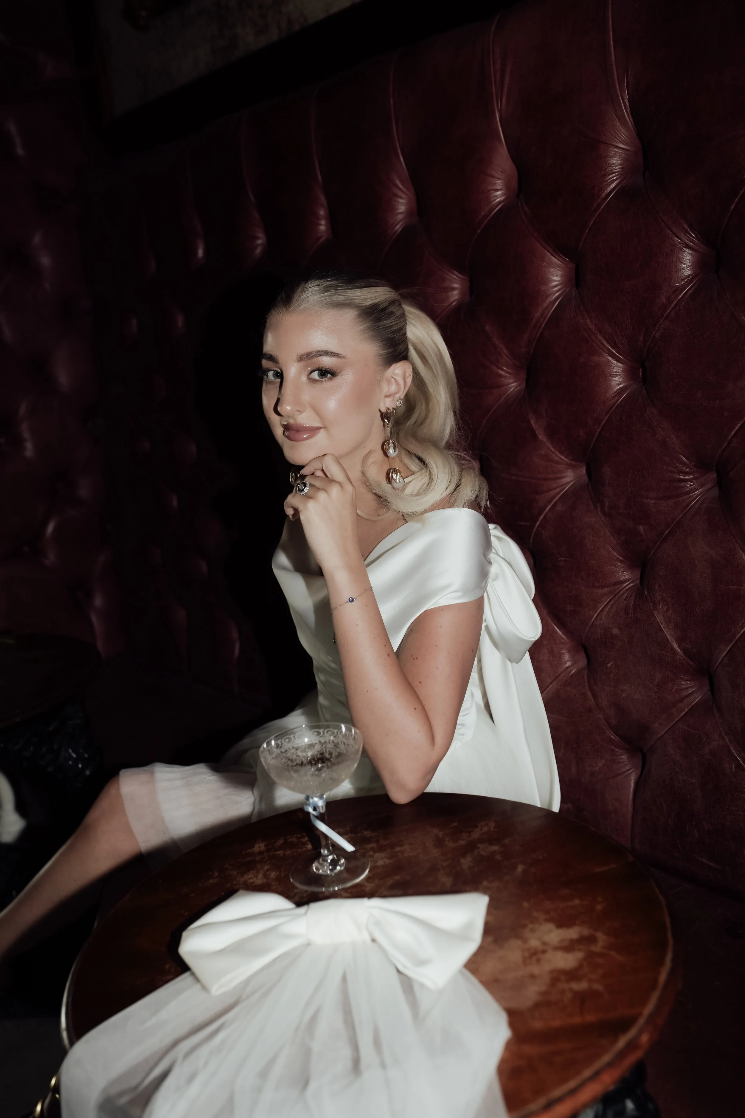 Modern bridal portrait with soft glam makeup, glowing skin and elegant bridal styling.