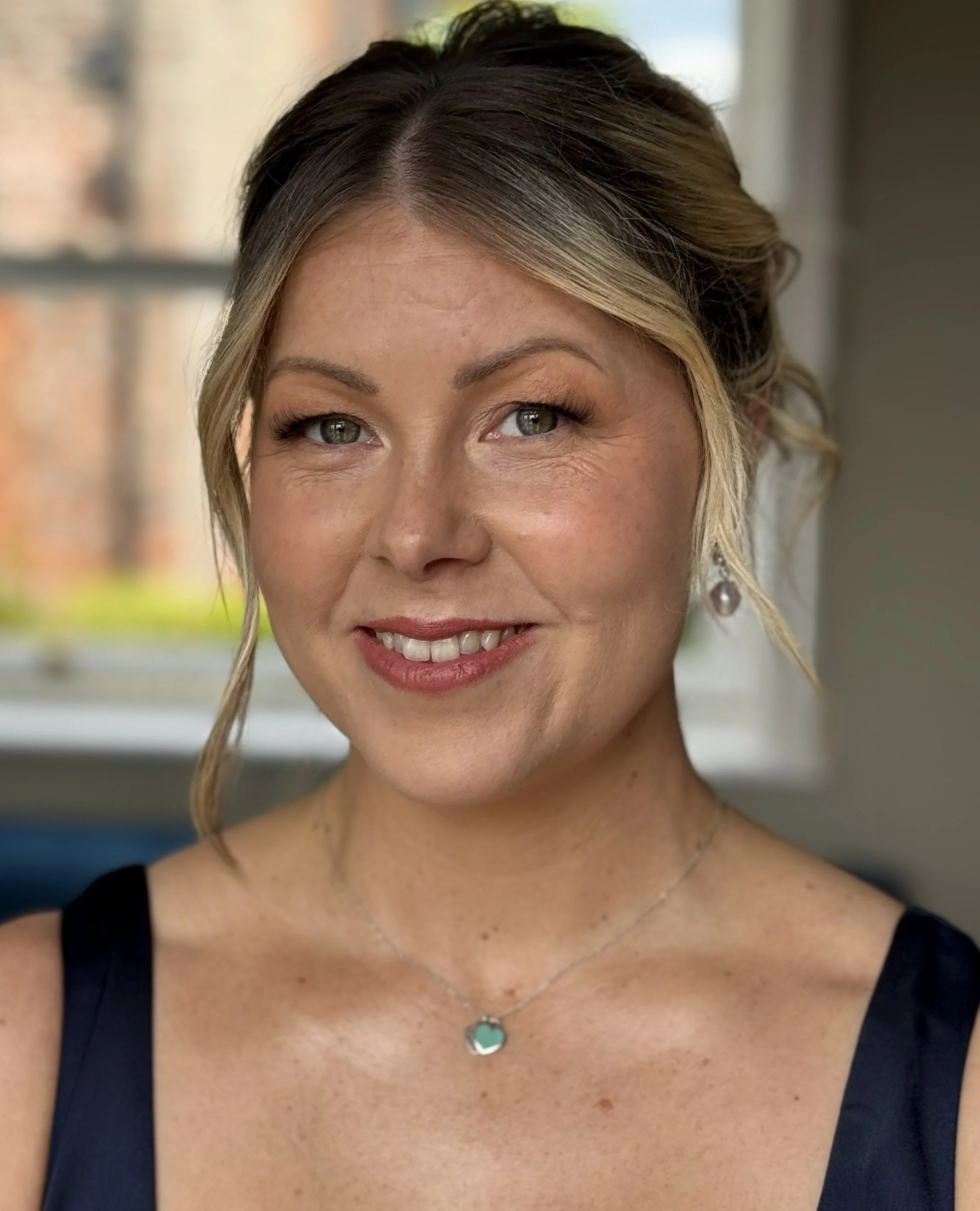 Bridal beauty close-up showcasing radiant skin, soft eye makeup and timeless wedding day elegance.