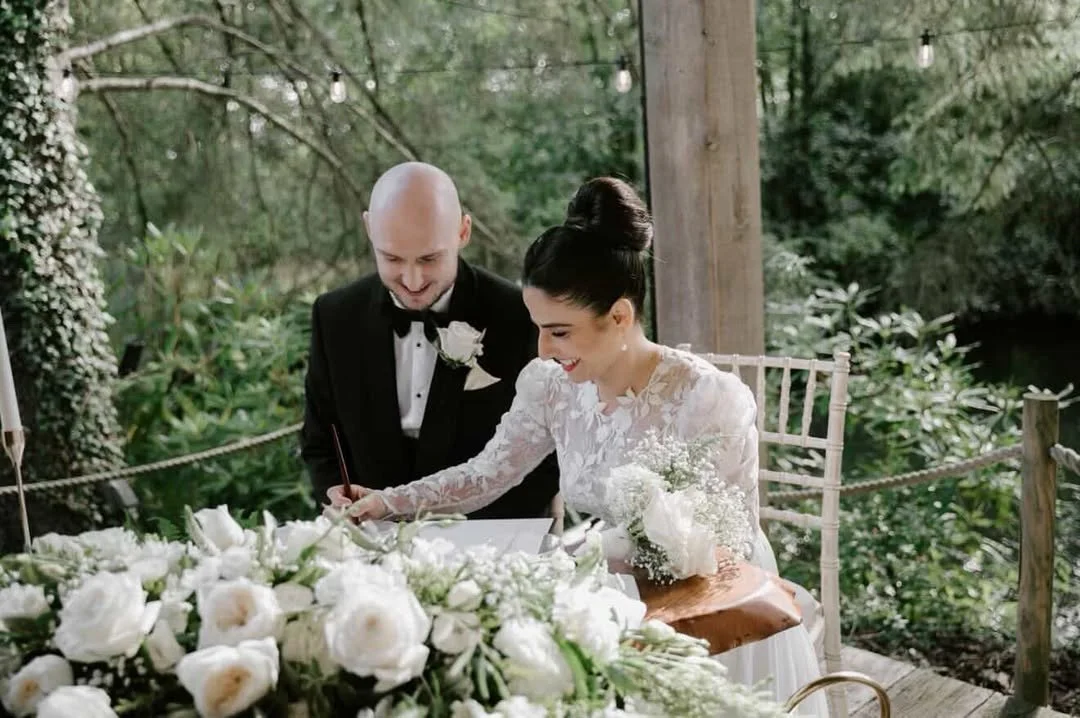 Outdoor wedding ceremony featuring a bride wearing luxury bridal makeup by Libby Addyman Makeup Artist.