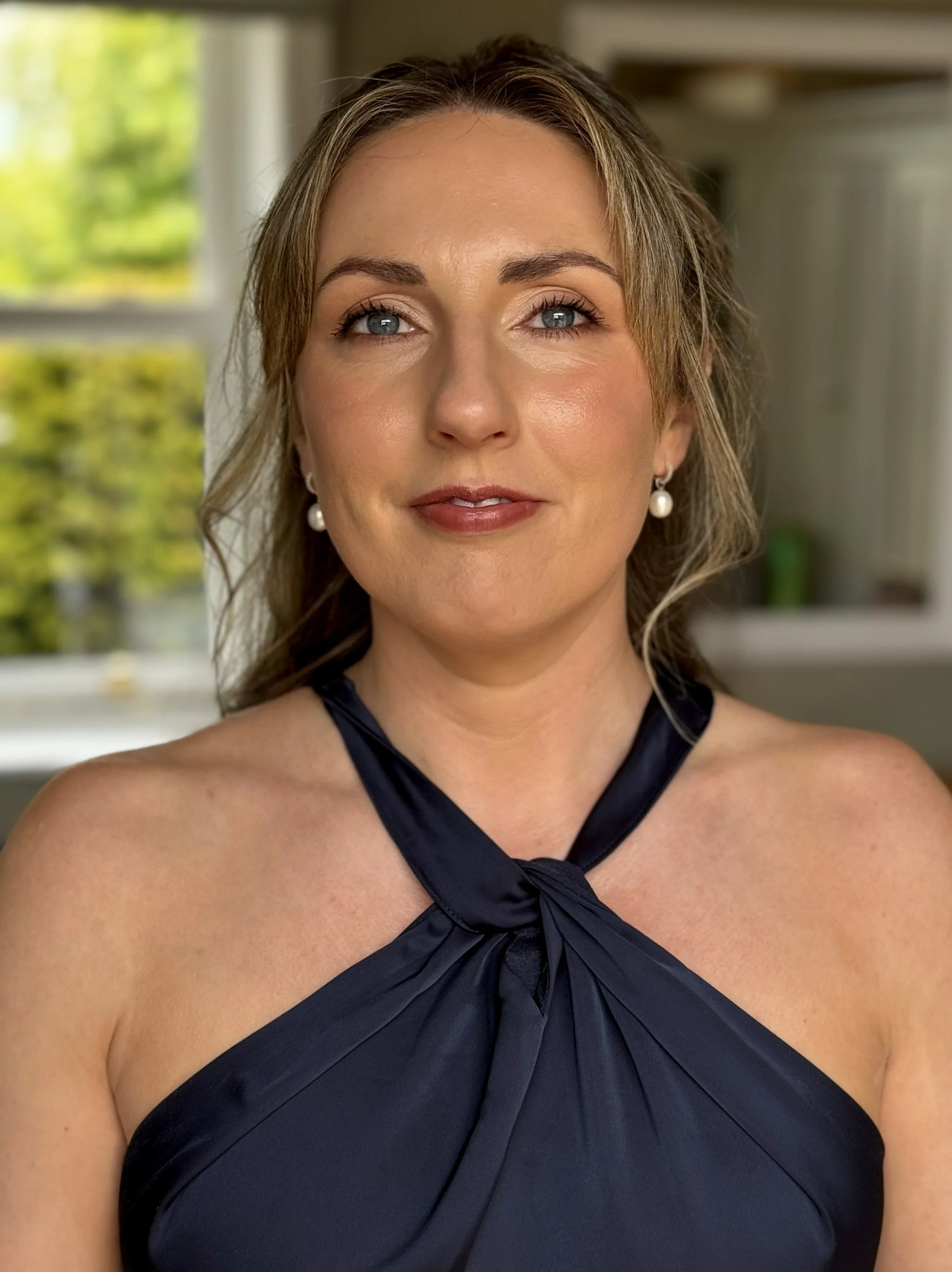 Bridal preparation portrait featuring luxury wedding morning beauty and professional bridal makeup artistry.