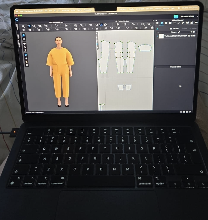 A laptop displaying a 3D modeling software with a female 3D character in yellow clothing on the left and the character's pattern design on the right.