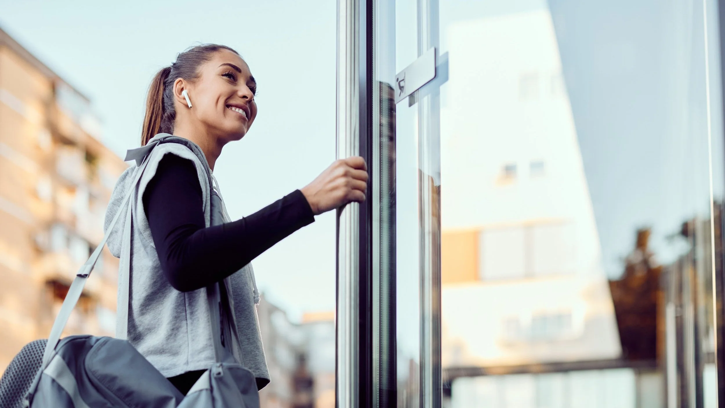 below-view-of-happy-athletic-woman-entering-in-a-g-2023-02-02-19-39-17-utc.jpg