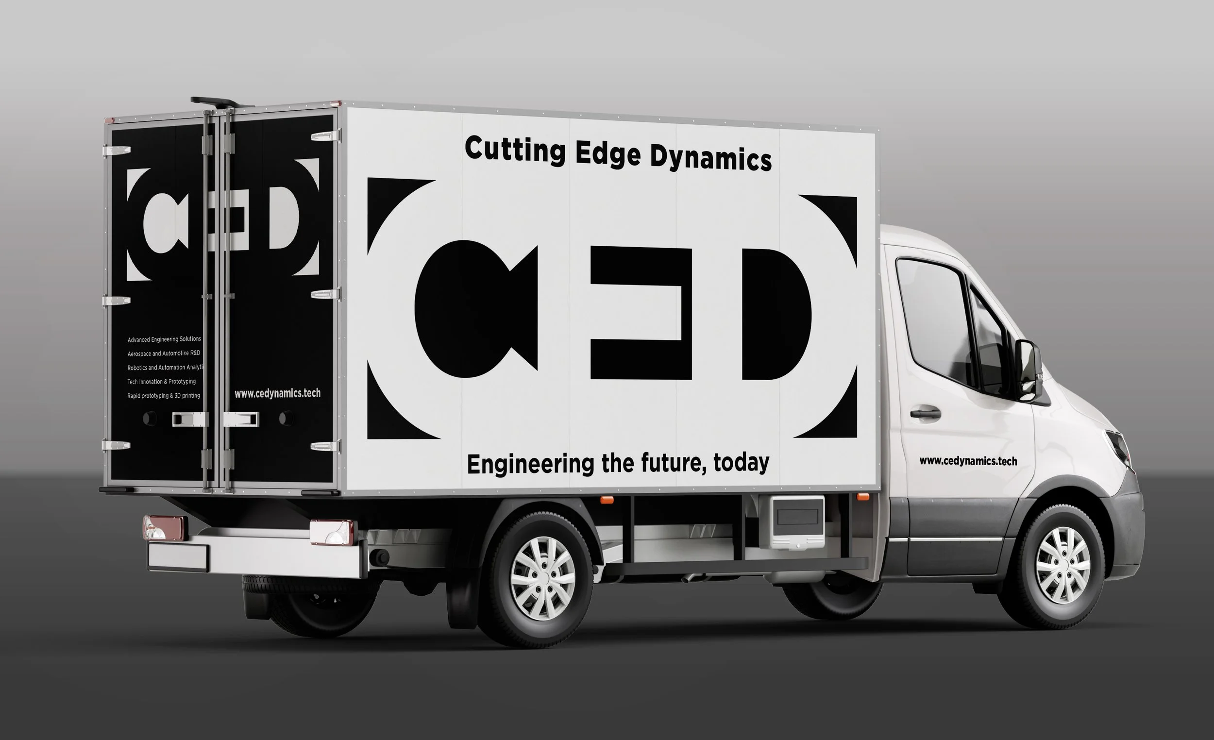 A white delivery truck with black and white advertising for Cedynamics, featuring the company's logo, website, and slogans about cutting edge dynamics and future engineering.