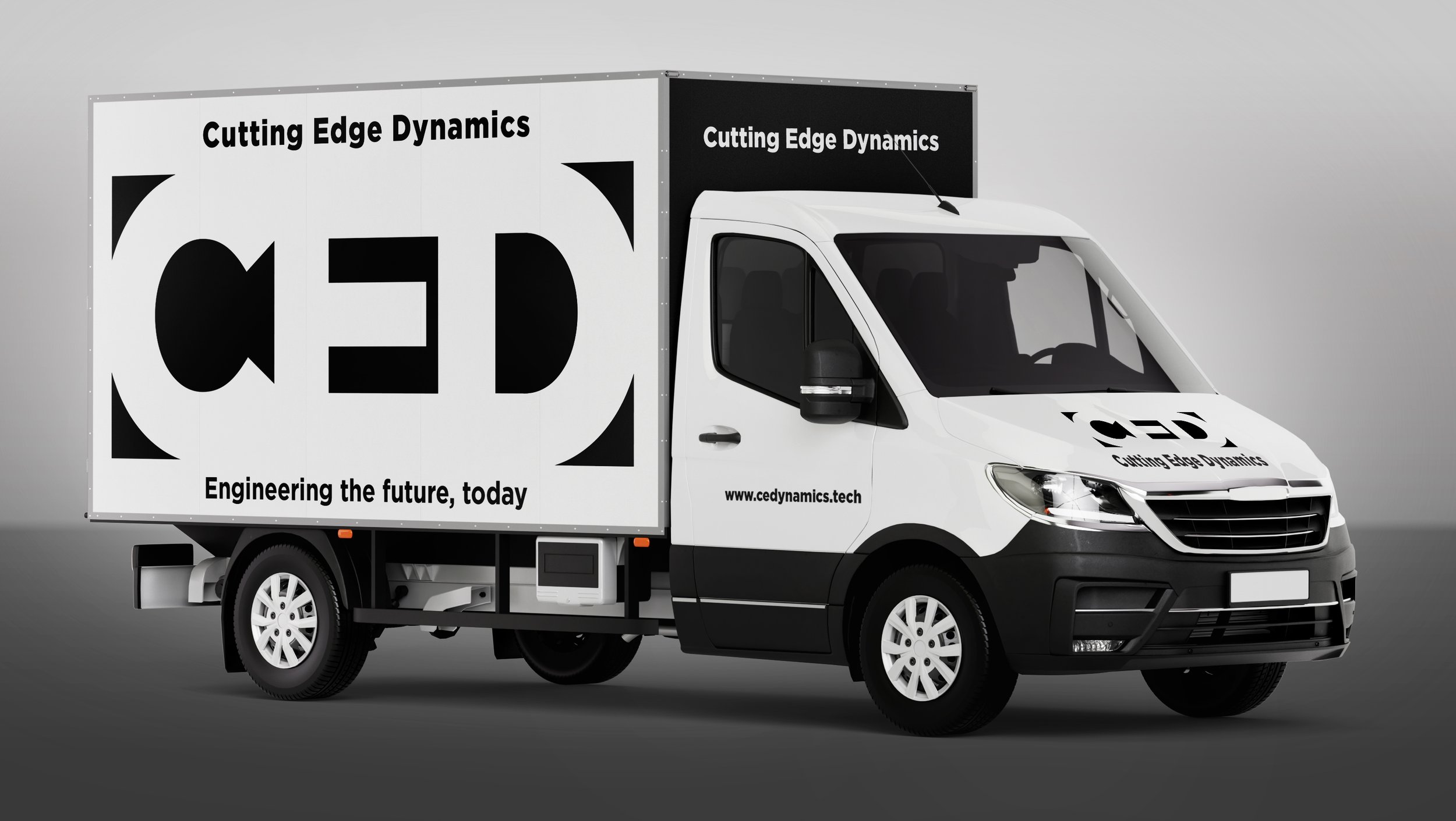 A delivery truck with the logo 'Cutting Edge Dynamics' and the slogan 'Engineering the future, today' on the side. The truck is white with black accents, featuring the company's website www.cedynamics.tech.