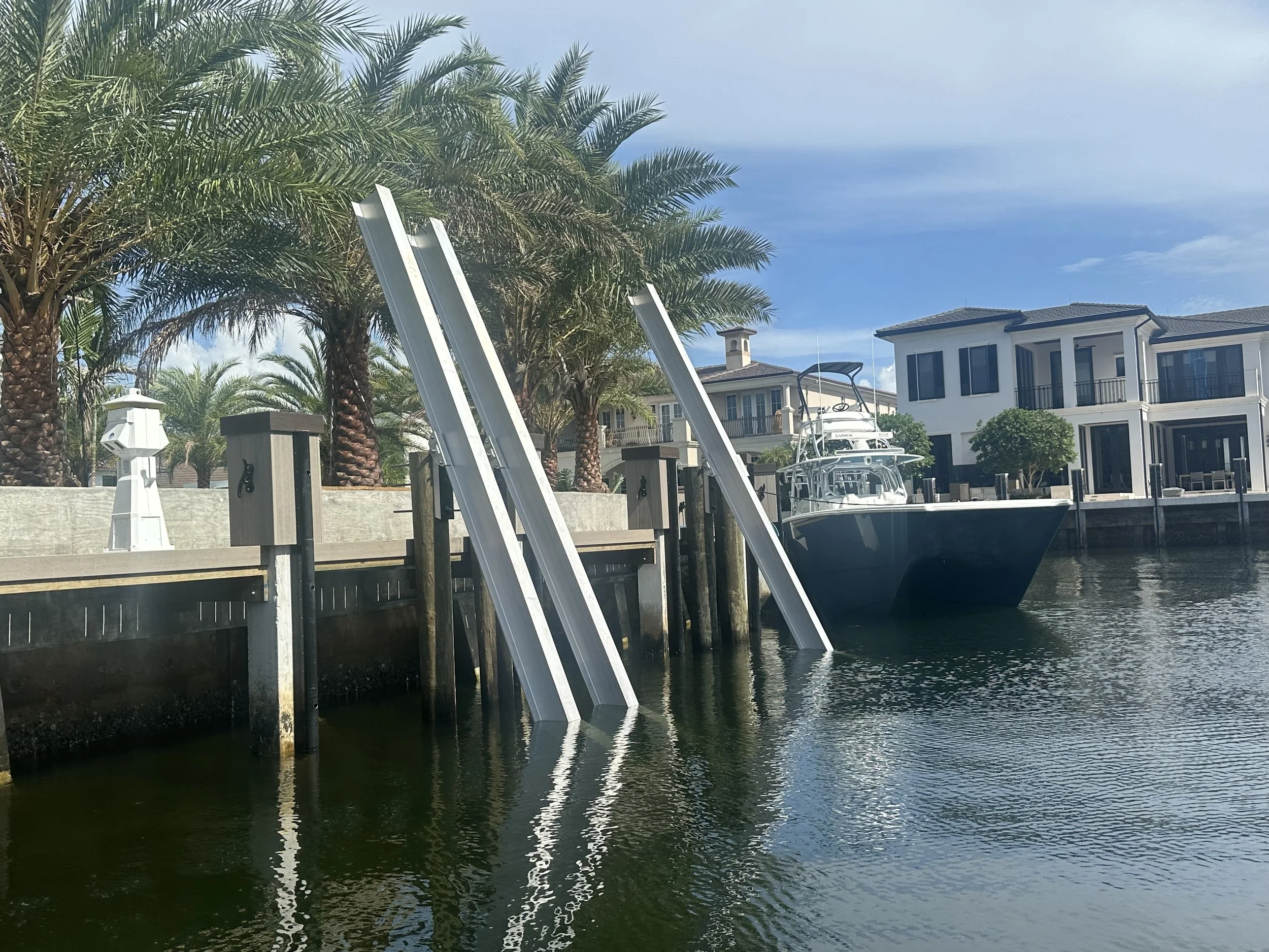 40k High Tide boat lift installation on Boca Raton, Florida.  Serving Palm Beach, Broward, and Martin County waterfront homes.