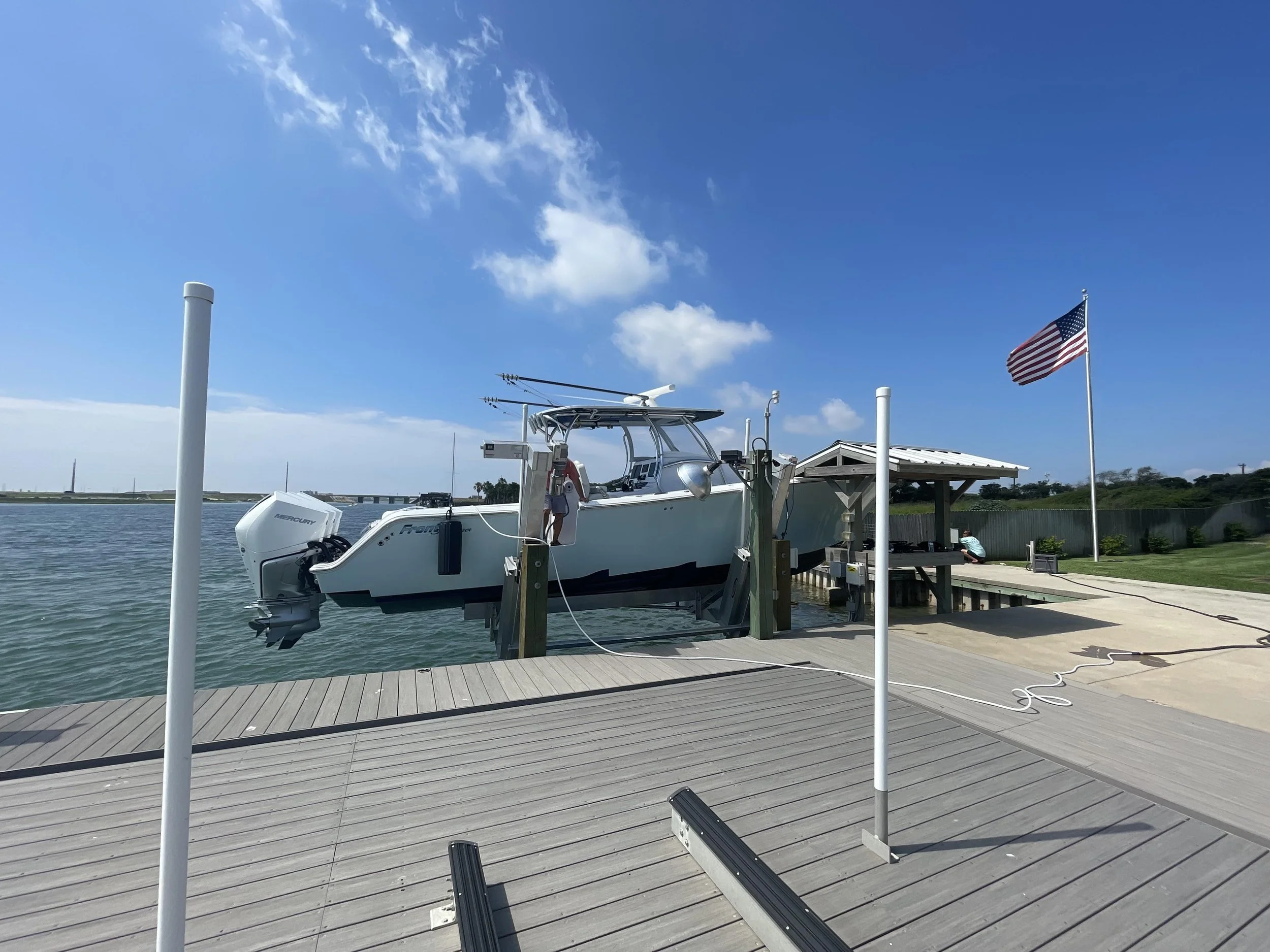 An image of a residential dock with a boat lift system