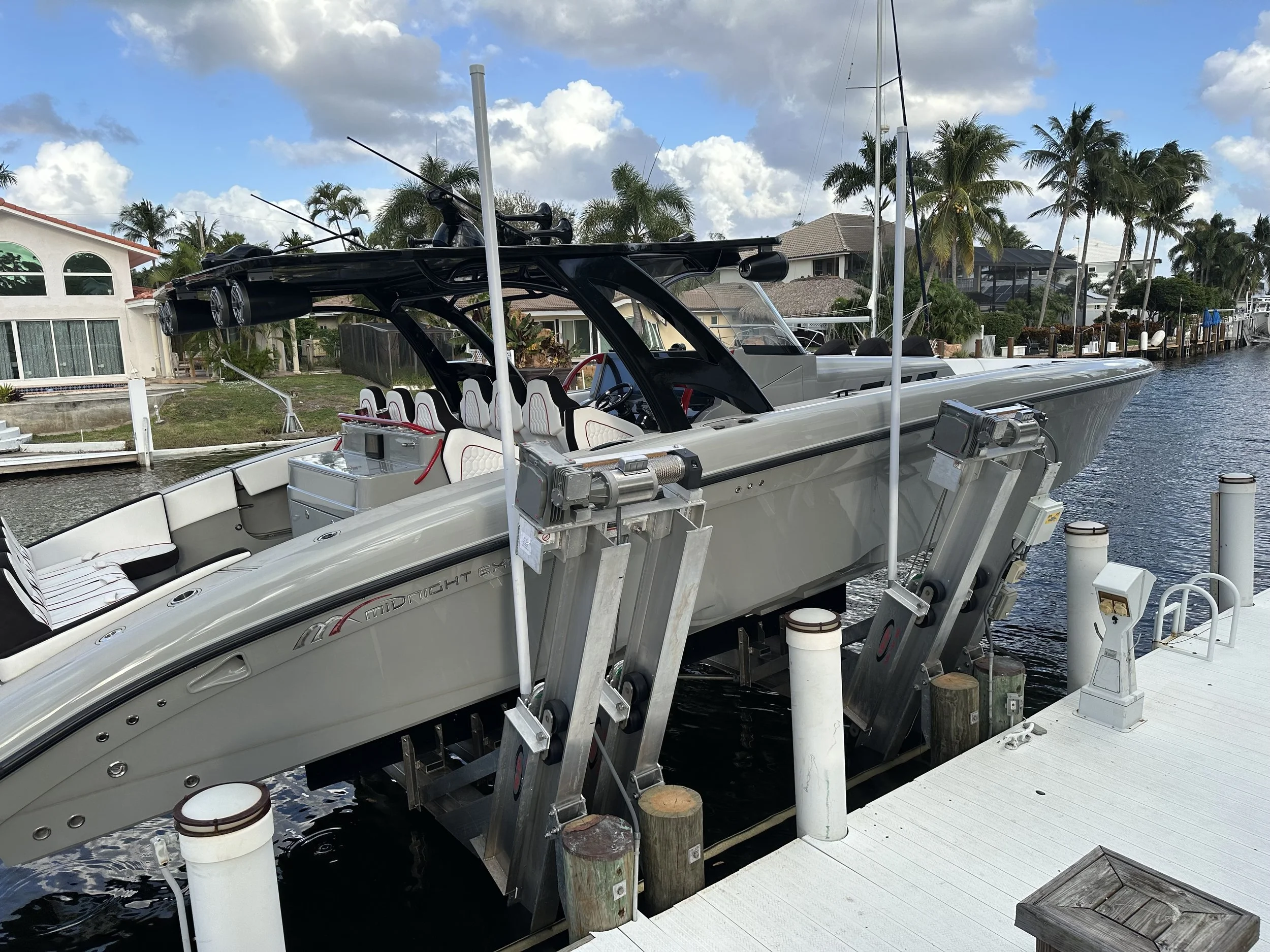 27,000 Lb Hurricane Elevator Boat Lift installed by JKT Marine Construction in Lighthouse Point Florida for a large center console vessel on a waterfront canal property.