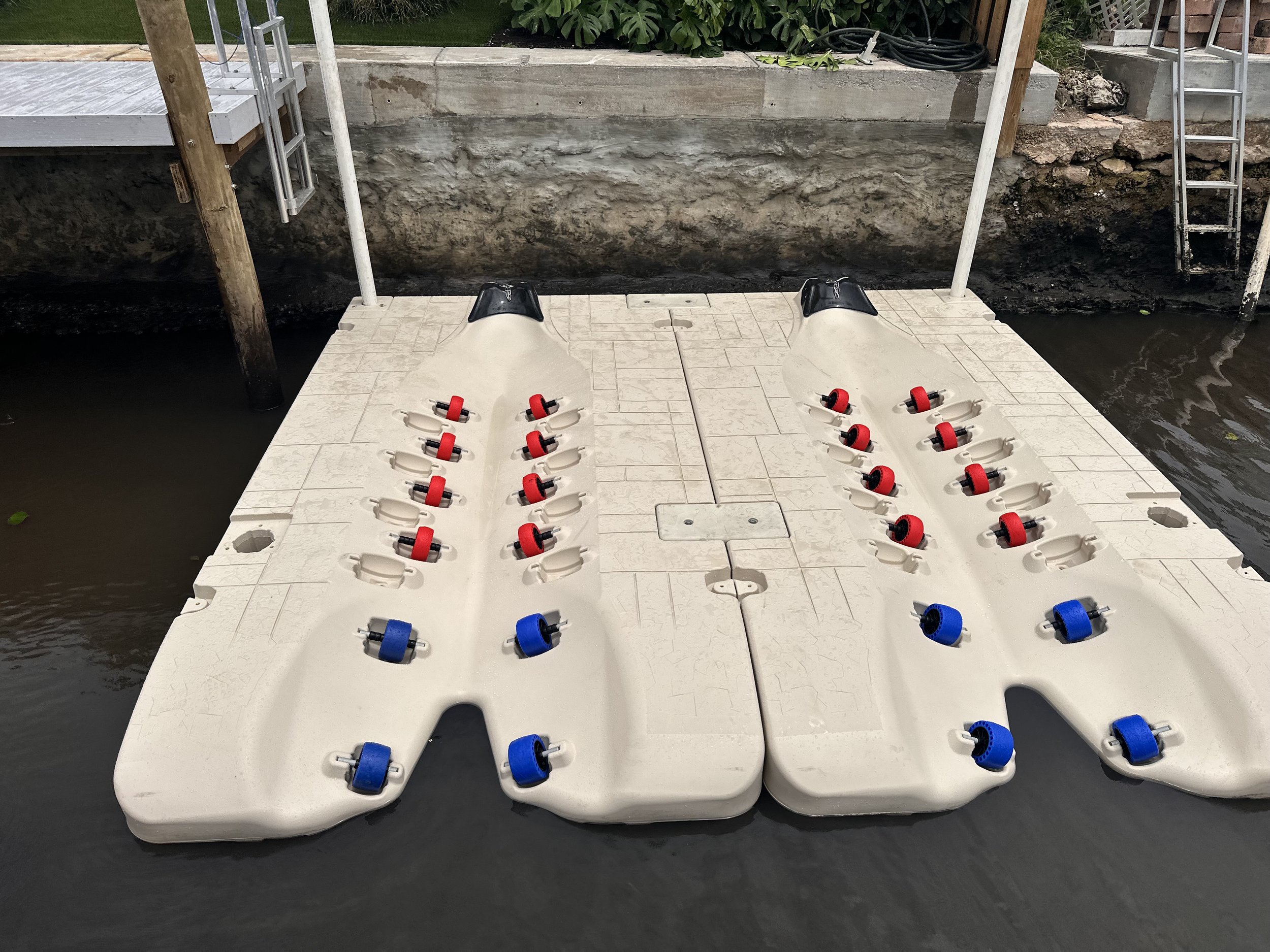 Floating dock and jet ski port installation by JKT Marine serving Boynton Beach, Florida. Serving Palm Beach Broward, and Martin County waterfront properties.