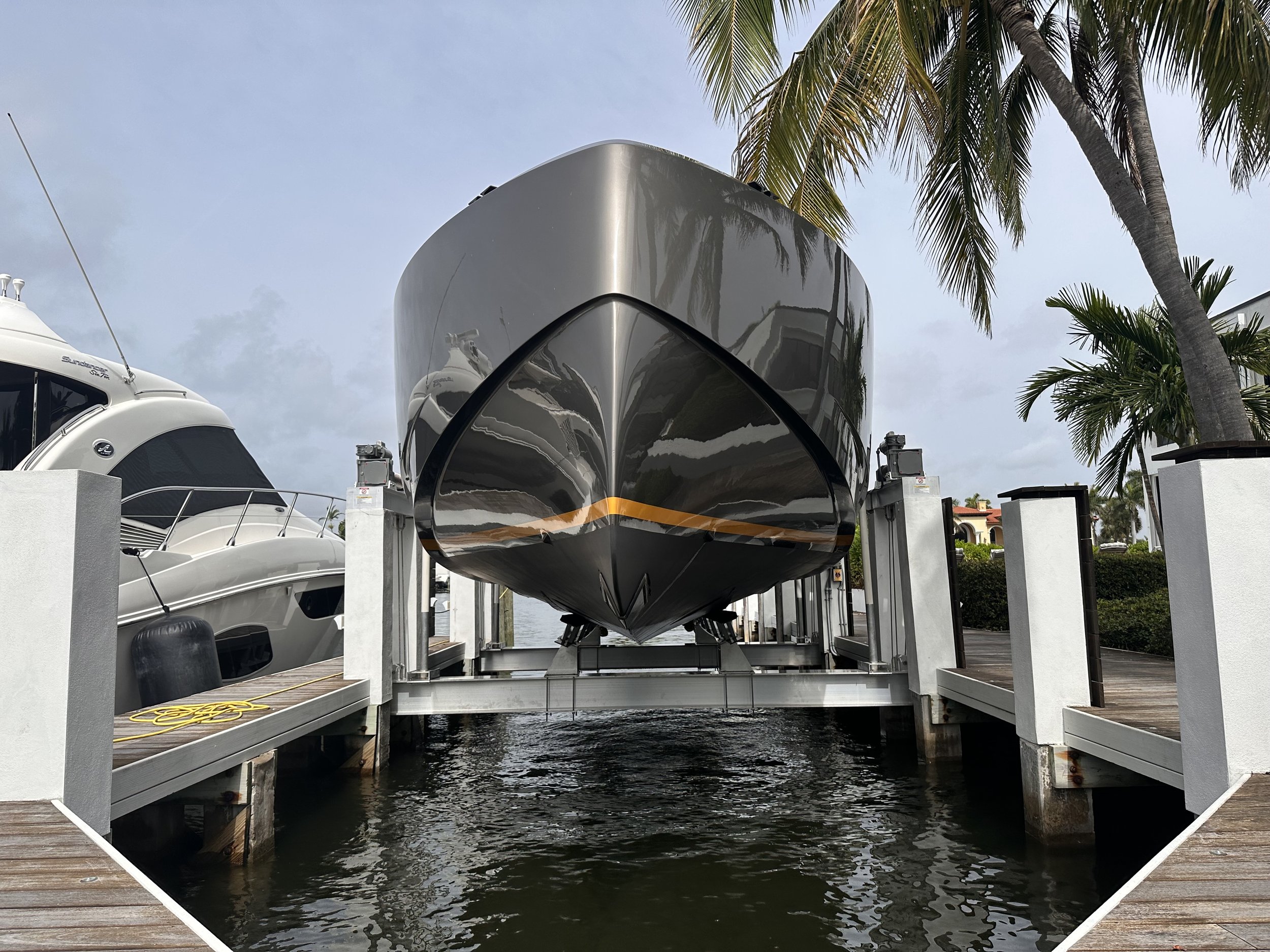Premium 50k Hurricane boat lift installation by JKT Marine done in Fort Lauderdale waterfront property.