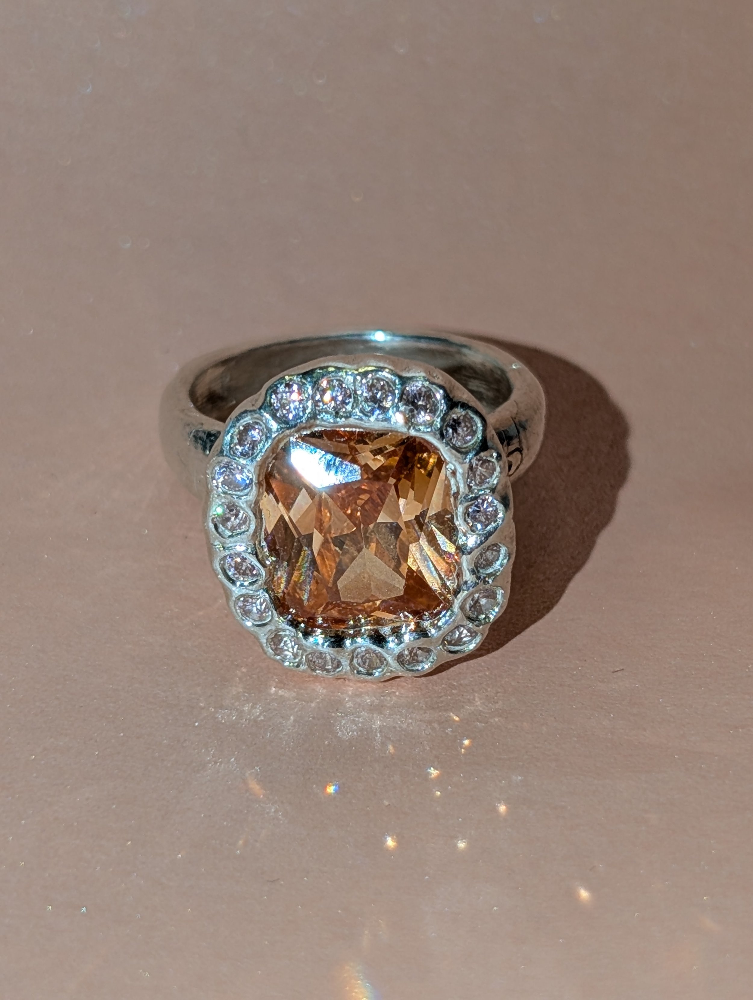delifini orange cushion cut ring with pink stones