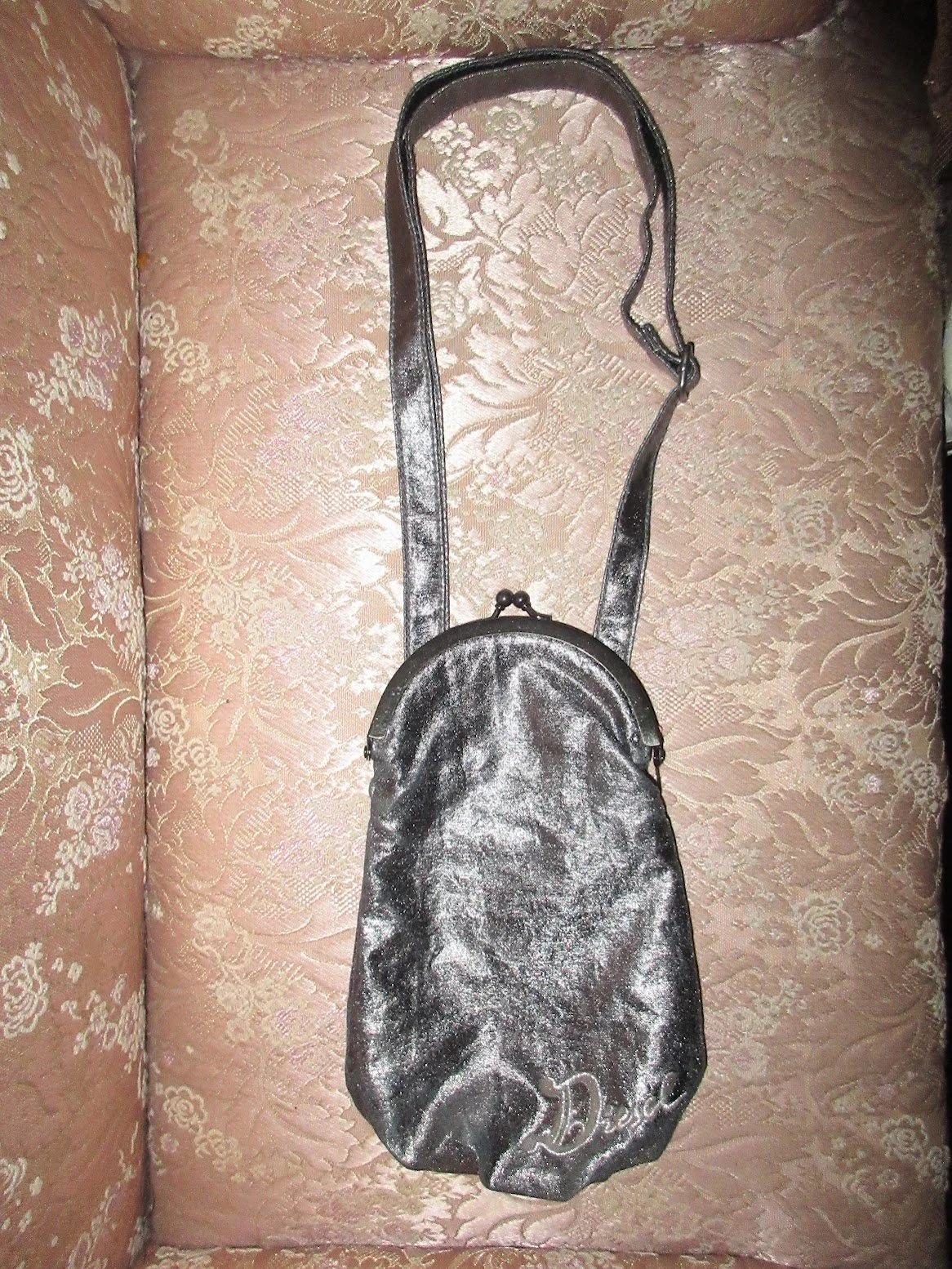 illocana Diesel metallic silver kisslock mini bag