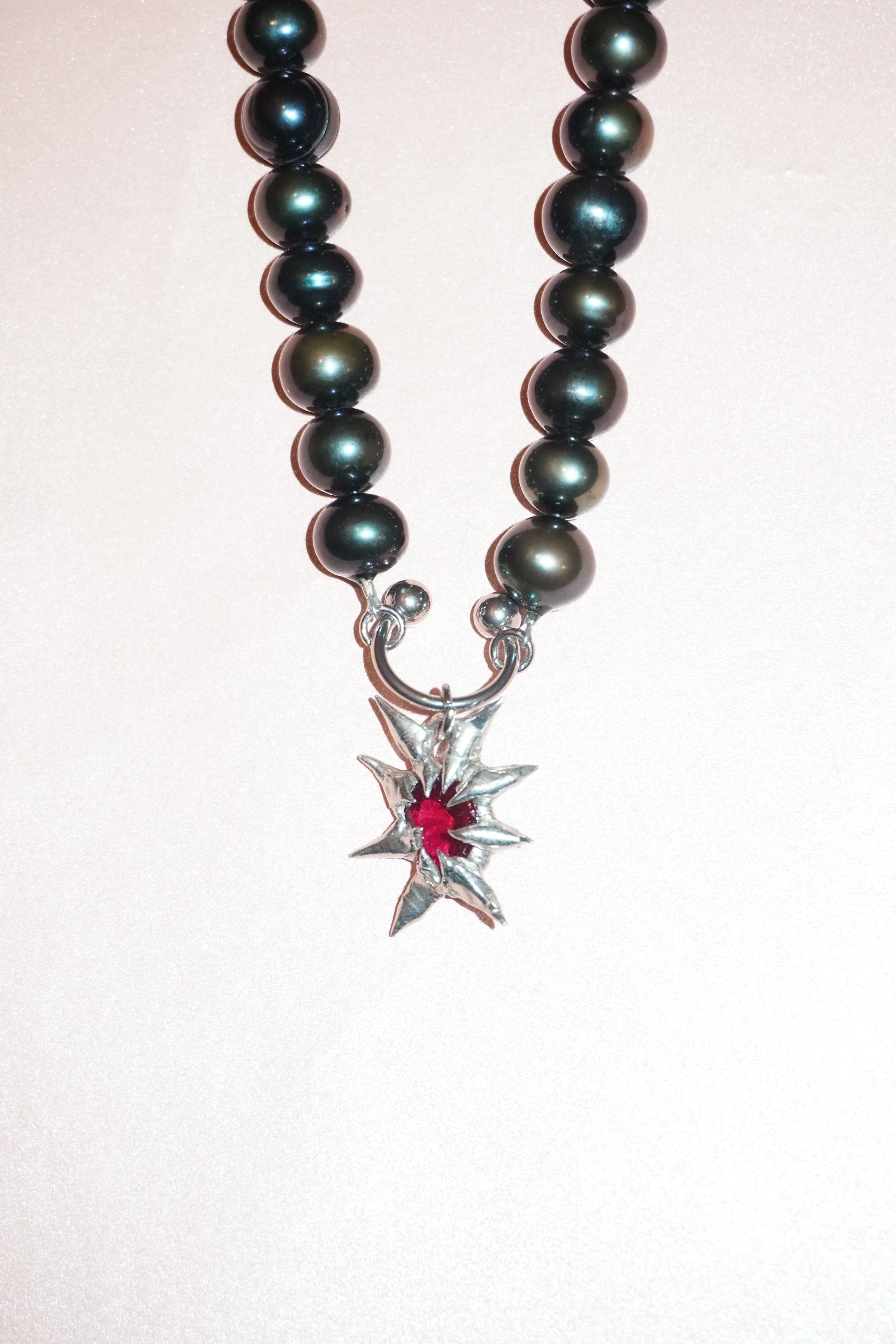 My Dearest World black pearl necklace with pierced spiky gem