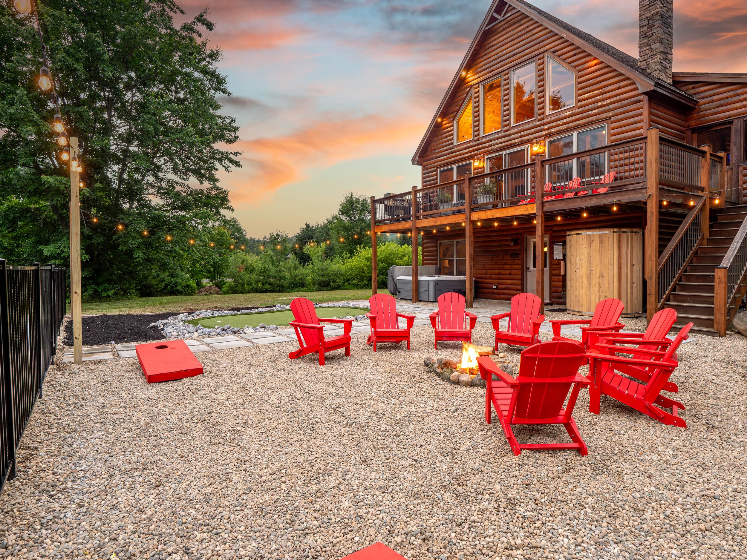 Family-friendly yard with fire pit at The Lone Star at Sunday River chalet in Sunday River area near lakes and mountain adventures
