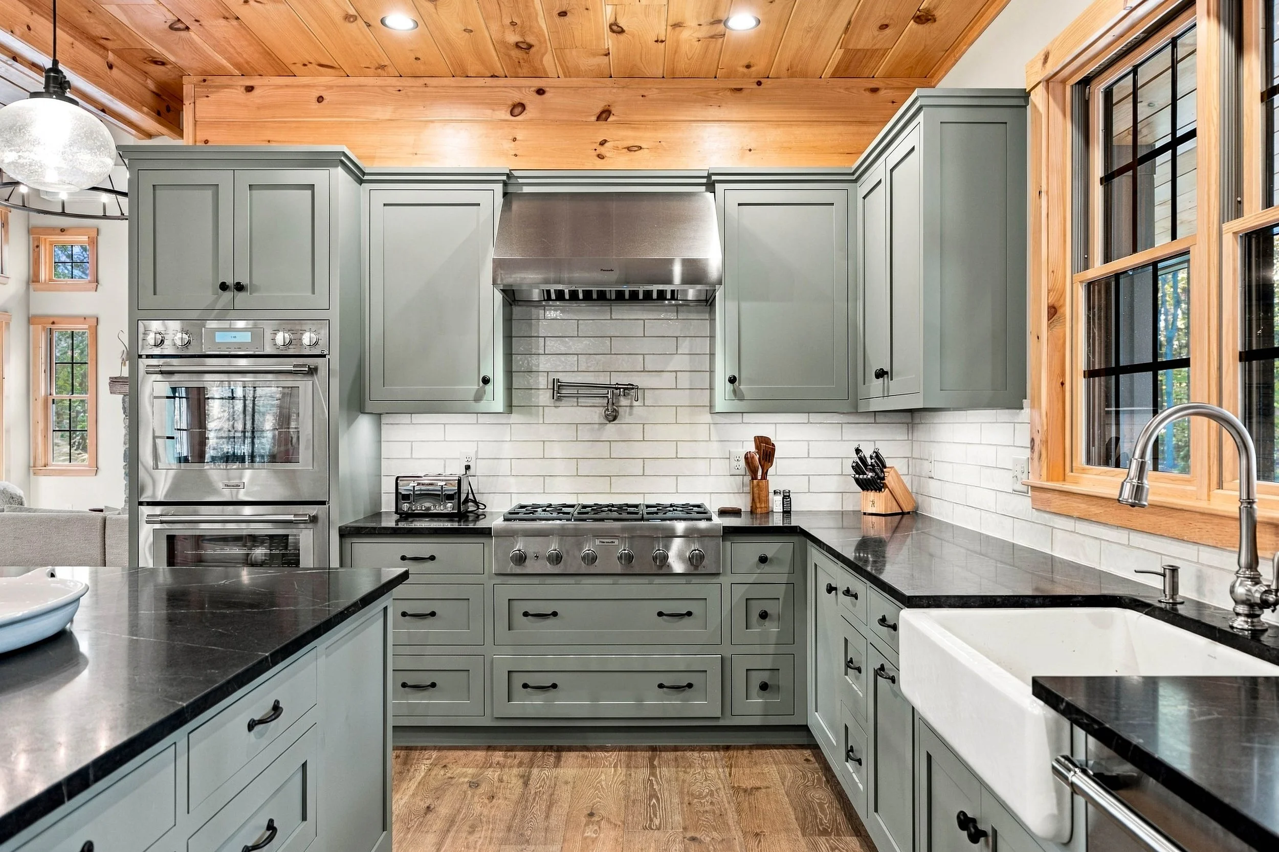 Cook with ease in the chef-inspired kitchen featuring Thermador appliances, a professional-style range, and elegant finishes.