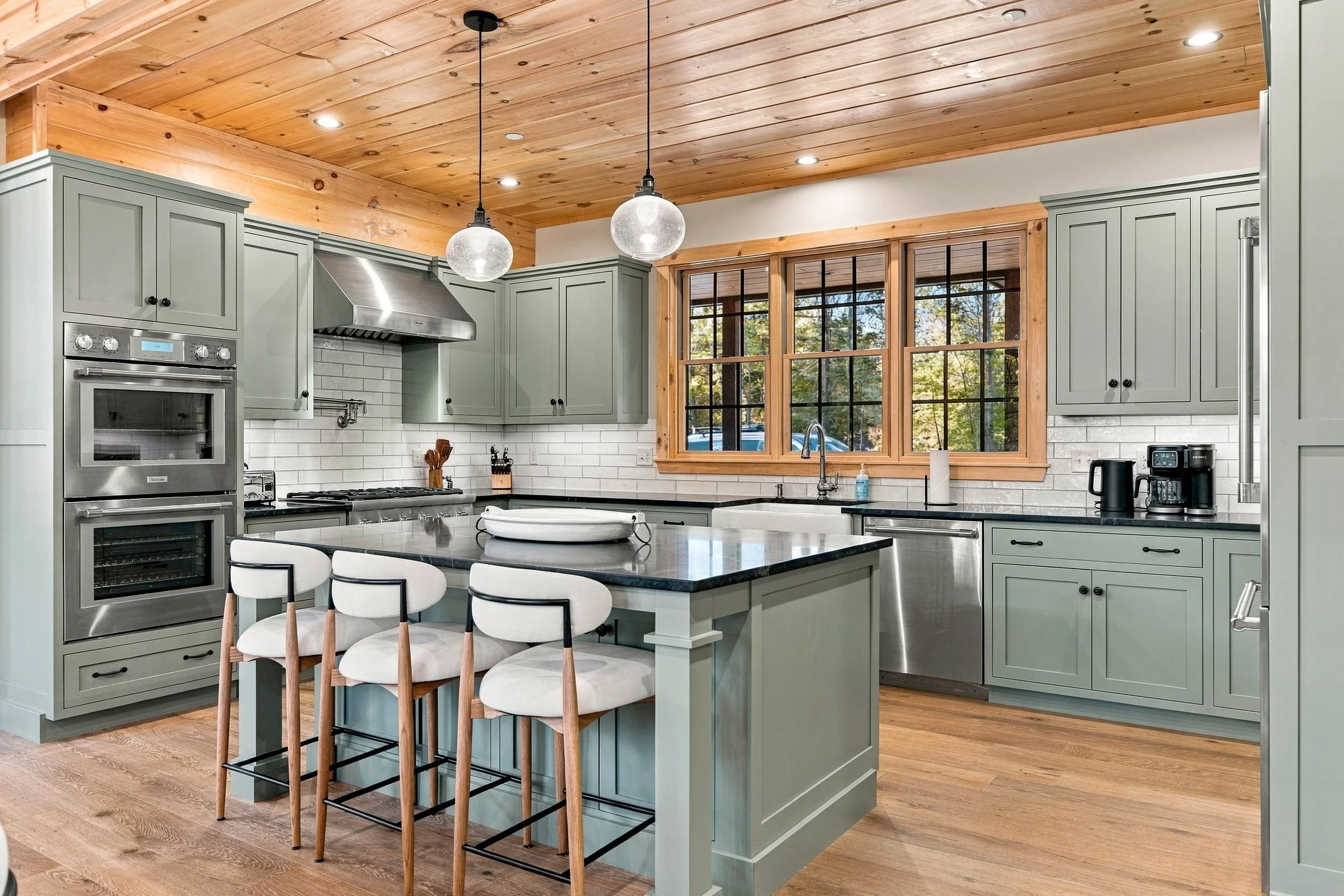 Enjoy the beautifully designed gourmet kitchen with premium appliances, generous counter space, and an island perfect for gathering.