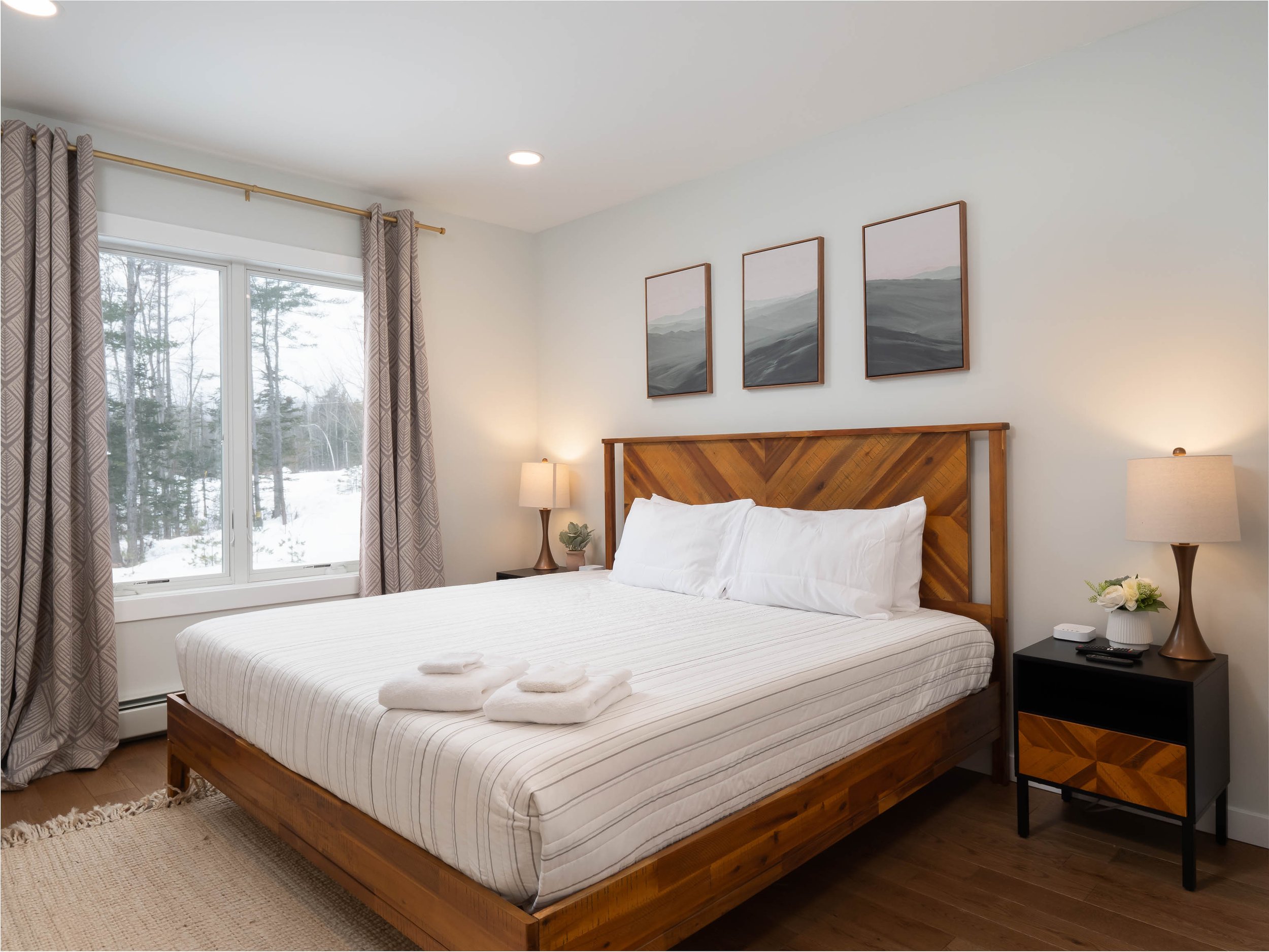 Beautiful bright bedroom with a cozy king bed at vacation rental in bethel Maine minutes to Sunday River