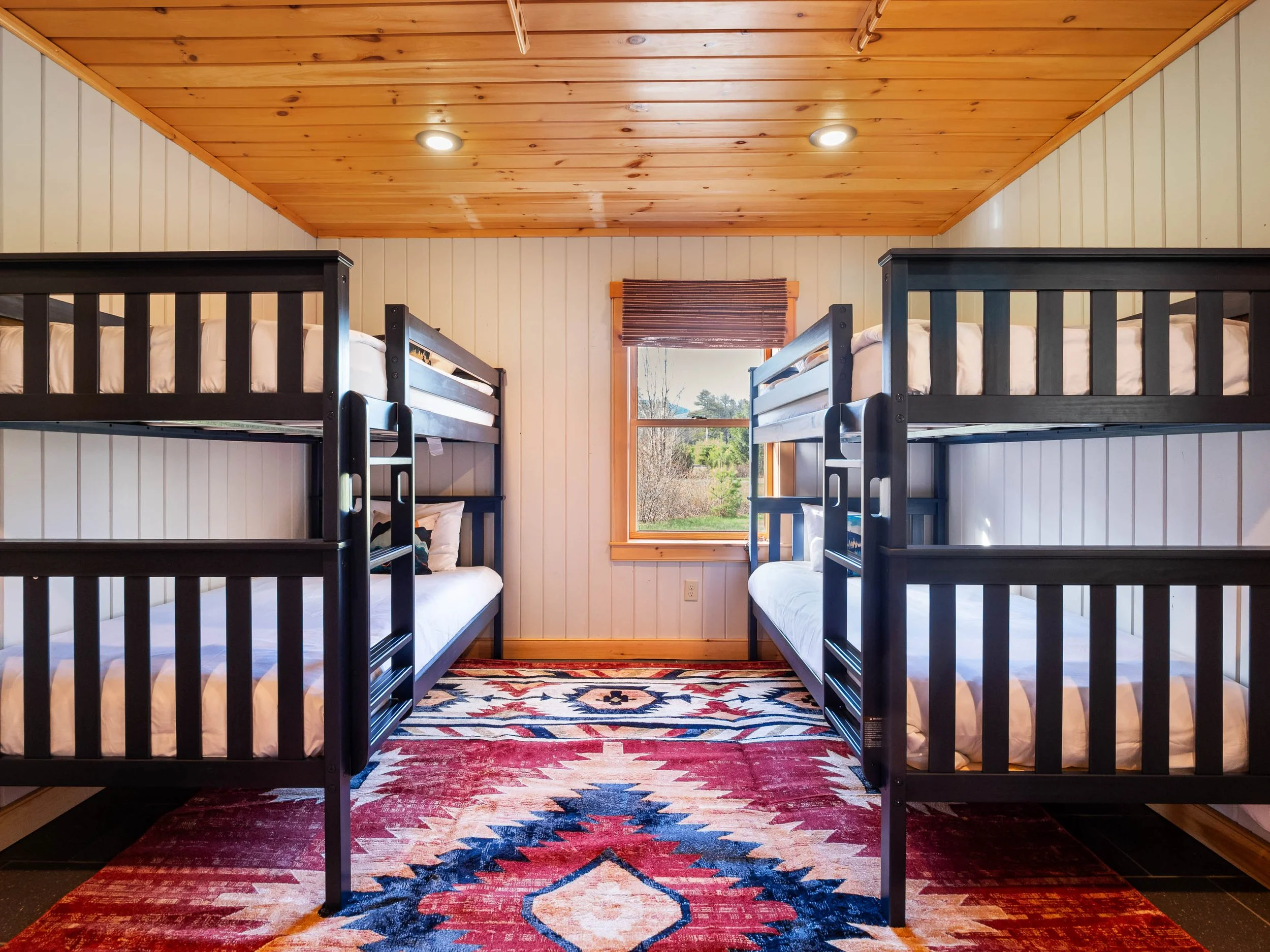 Family-friendly ground level bunk bedroom at The Lone Star at Sunday River Sunday River vacation rental in Newry Maine minutes from the slopes with cozy bedrooms