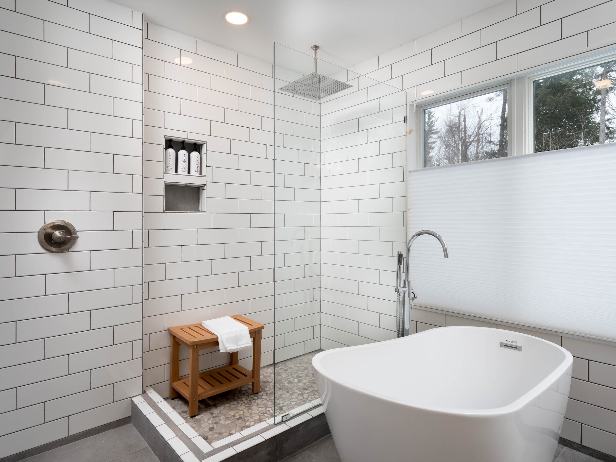 Luxury bathroom with freestanding bathtub in bethel maine chalet