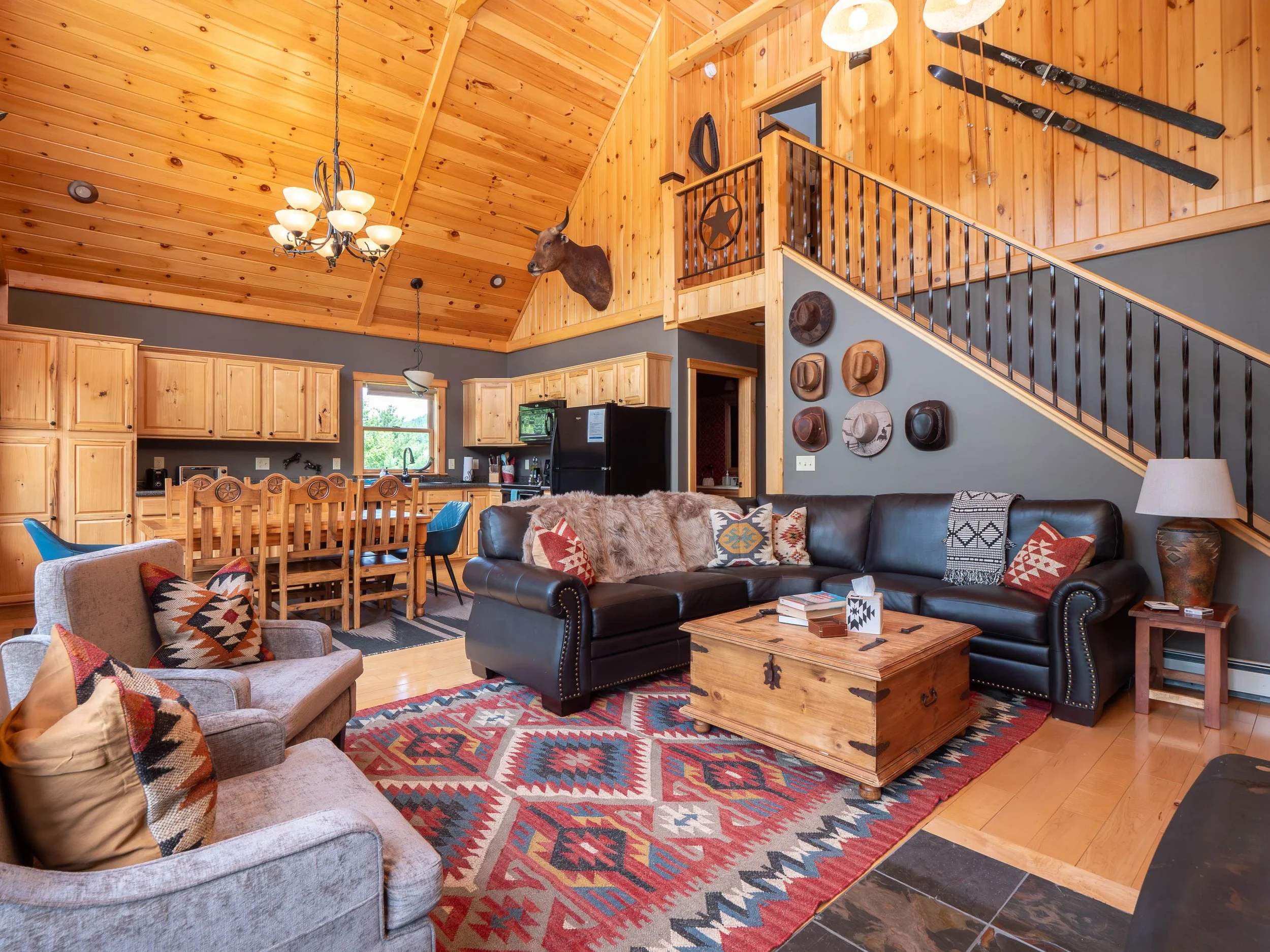 Open concept living room at The Lone Star at Sunday River family getaway in Sunday River area in the Western Maine mountains with comfortable seating