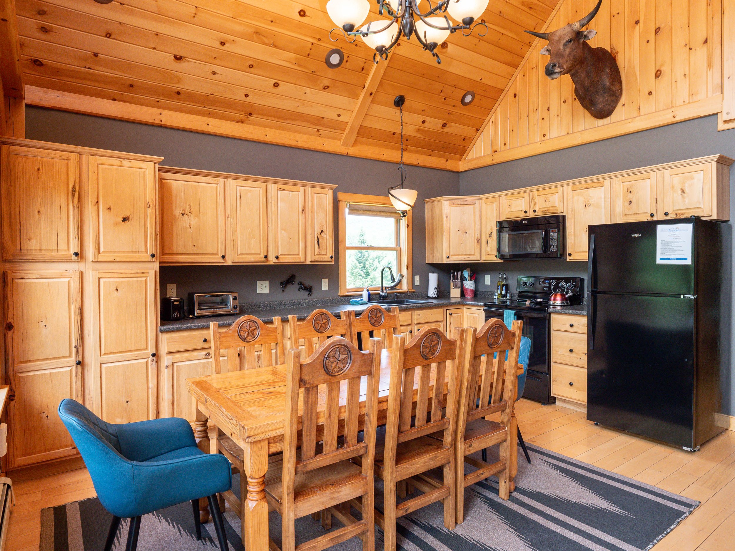 Open concept fully equipped kitchen at The Lone Star at Sunday River vacation rental in Newry Maine near Sunday River ski resort with mountain views