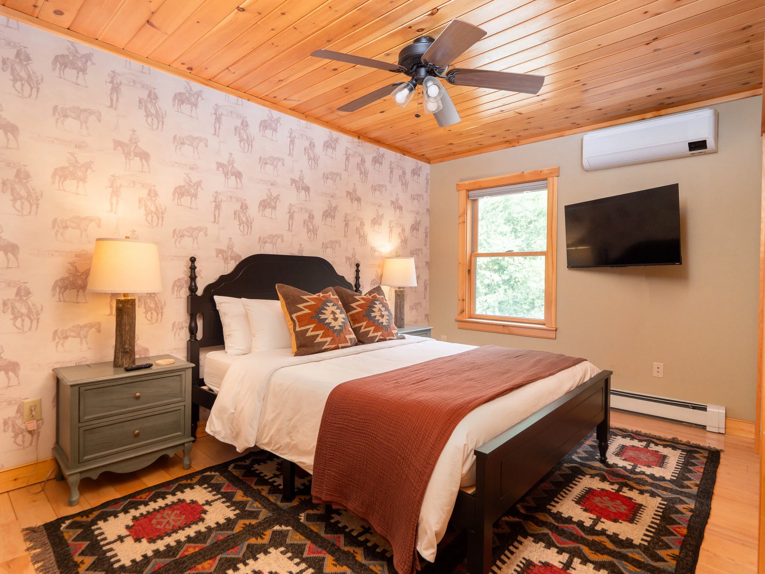 Cozy queen bedroom at The Lone Star at Sunday River vacation rental in Newry Maine near Bethel and Sunday River with seasonal mountain views