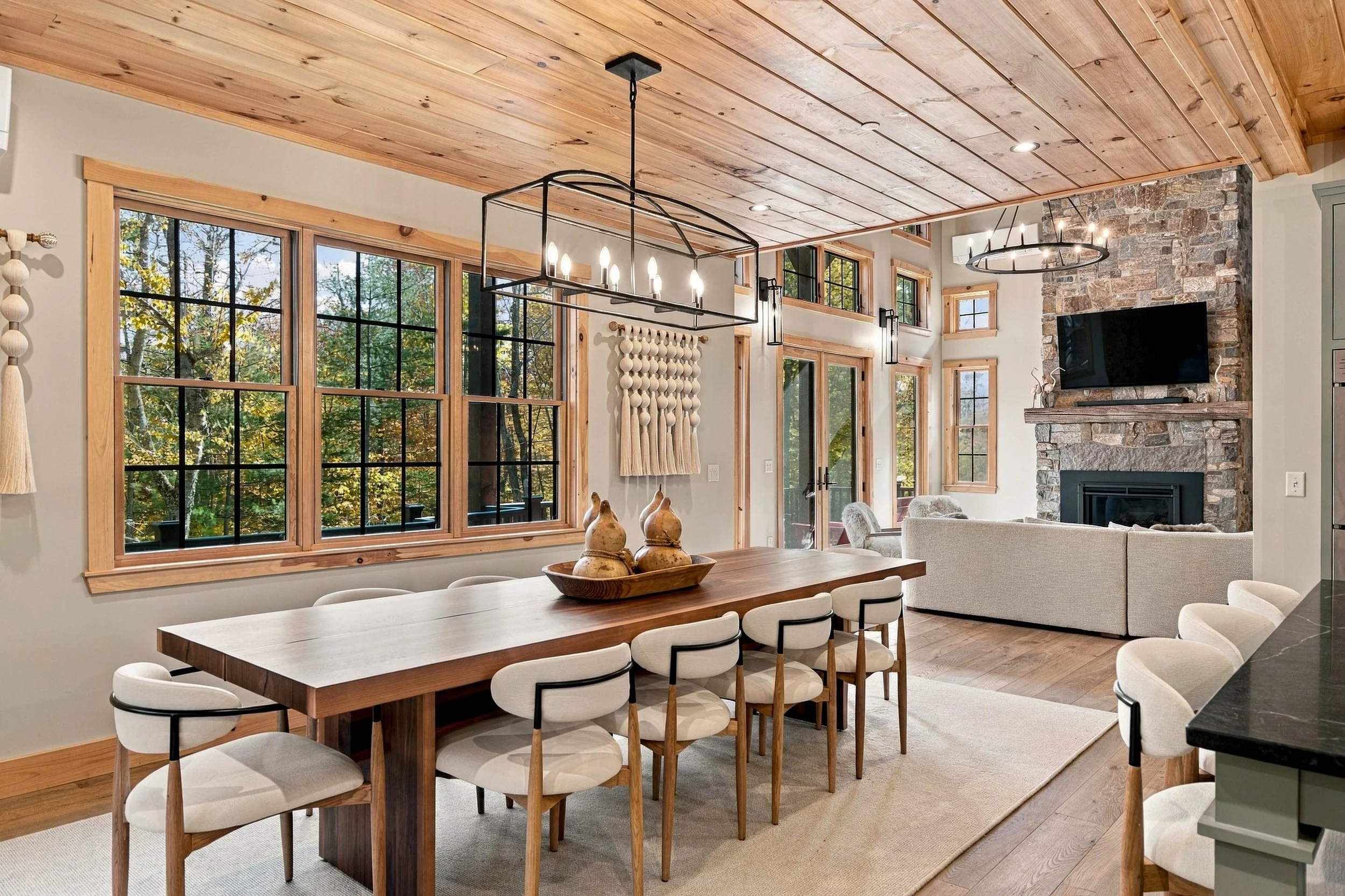 Gather around the dining table for memorable meals, with seating for 10 and beautiful views of the surrounding forest.