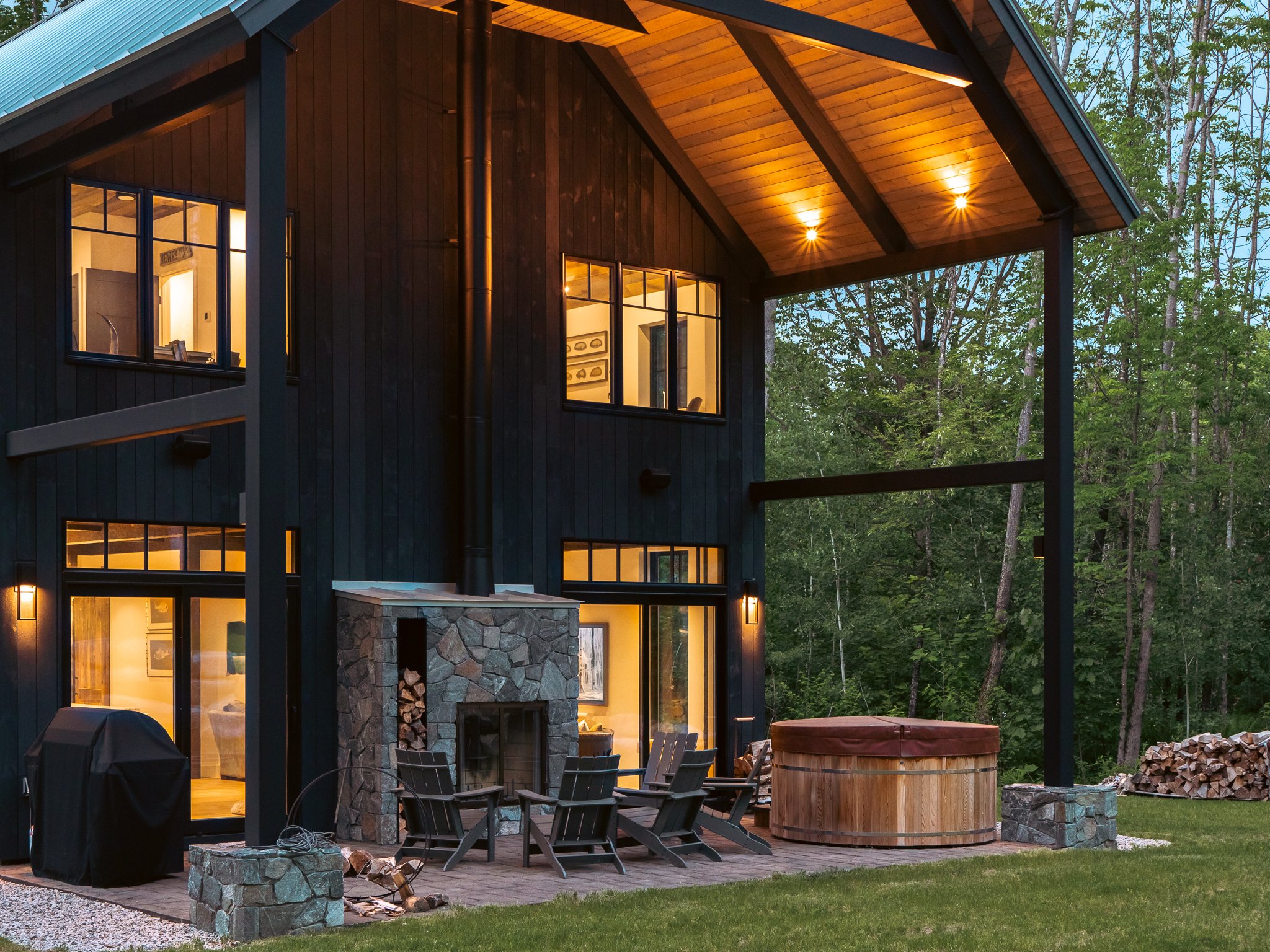 Modern cabin with outdoor firepit and hot tub