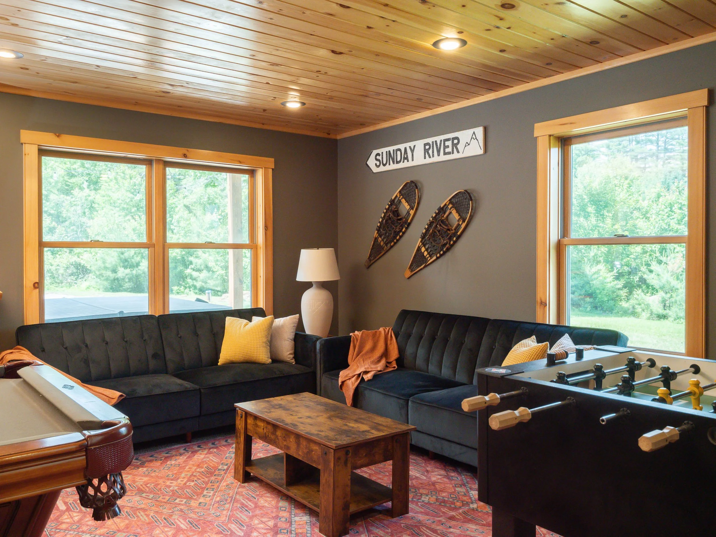 Well-appointed game room at The Lone Star at Sunday River ski house in minutes from Sunday River near swimming and outdoor recreation for family fun with two futons