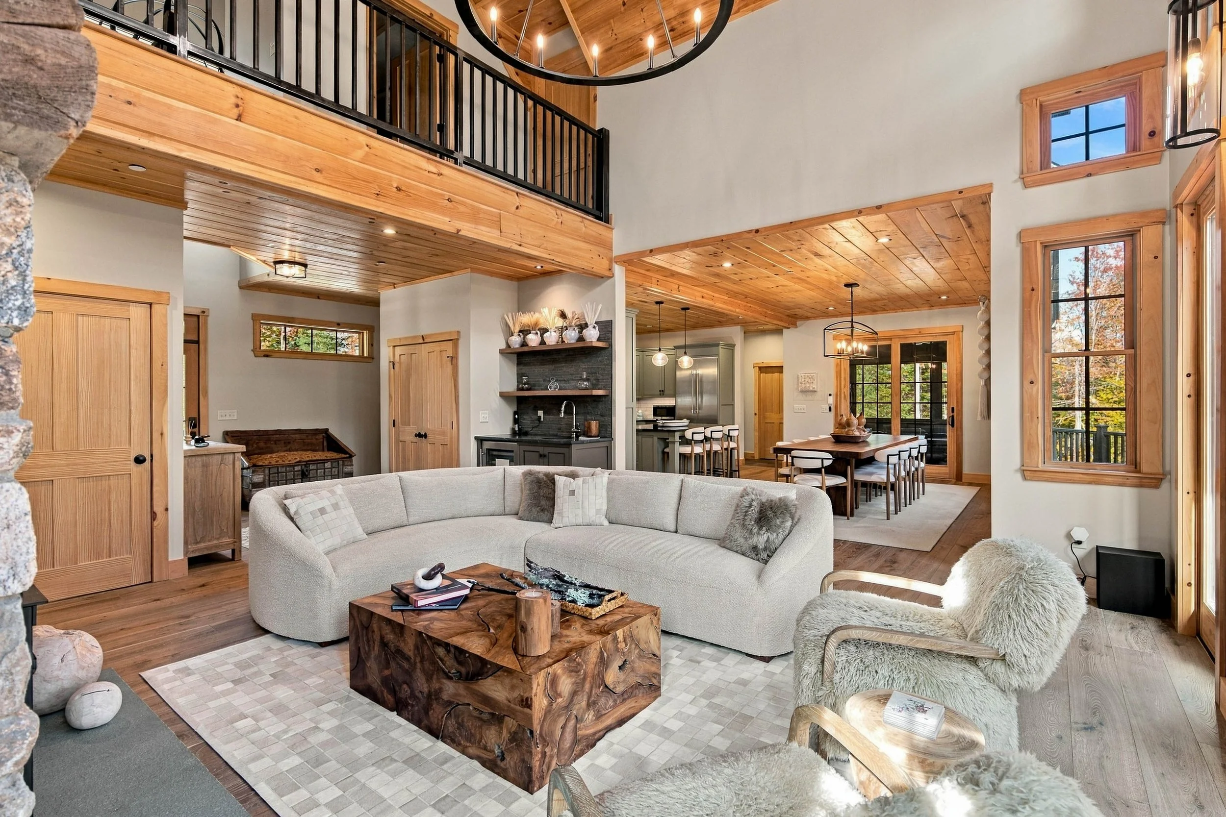 Walls of windows, comfortable seating, and open-concept design make this the heart of Morganite Estate.