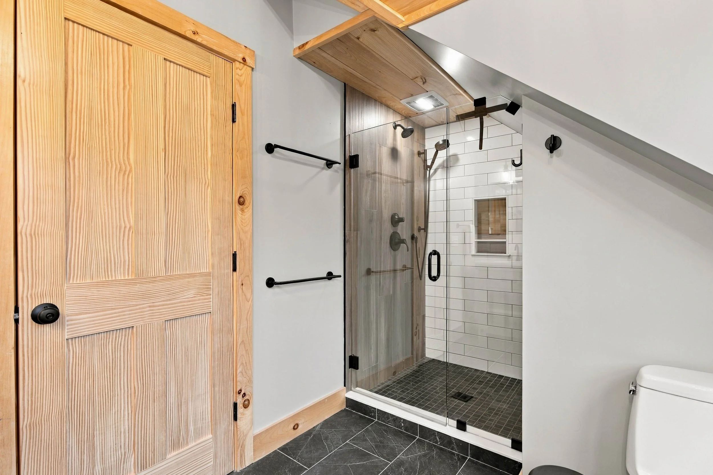 Refresh and recharge in the spacious walk-in shower featuring elegant tilework and modern fixtures.