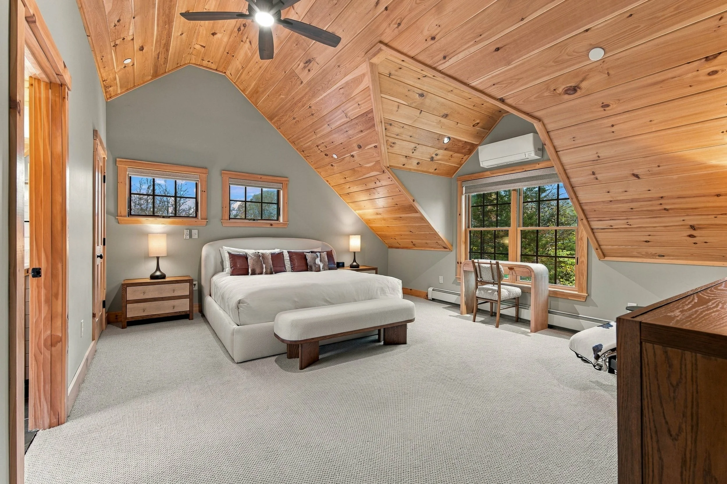 Retreat to this spacious king suite with vaulted wood ceilings, beautiful forest views, and a private ensuite bathroom.