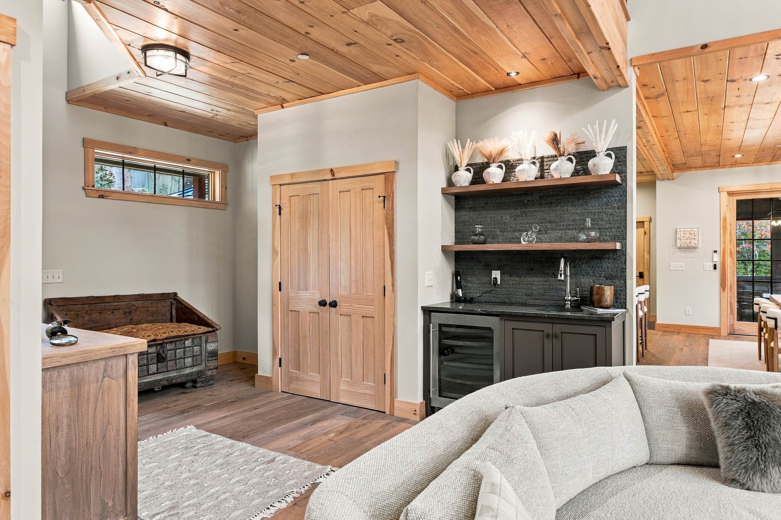 A convenient wet bar just off the great room makes entertaining and relaxing together effortless.