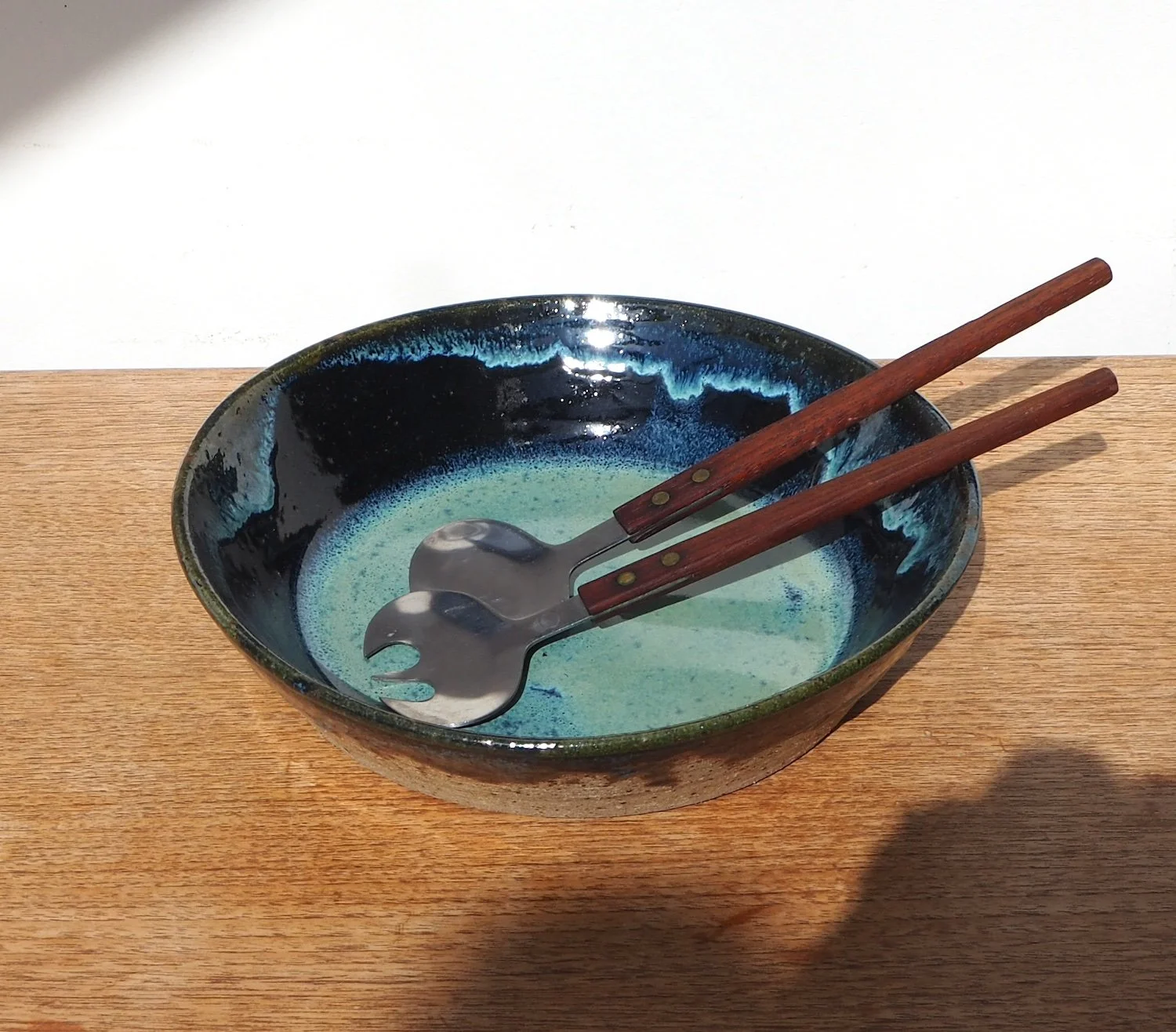 large salad bowl in drippy blue green glaze