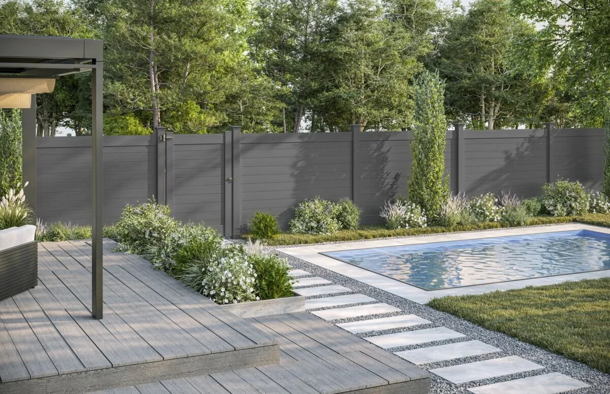 Family backyard protected by a pool fence in North Port, FL