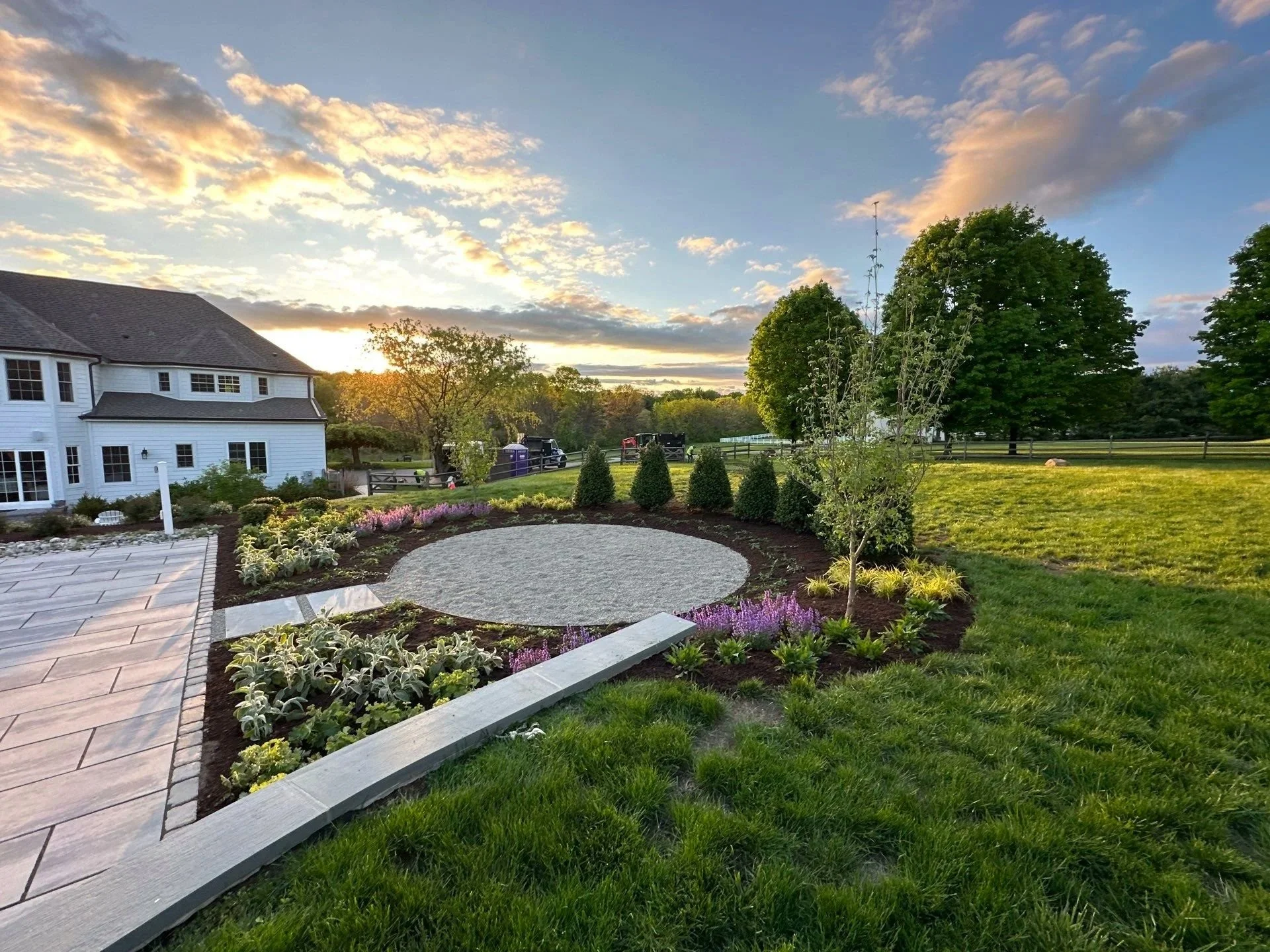 Paver pool patio, stone fire pit space and mulch garden