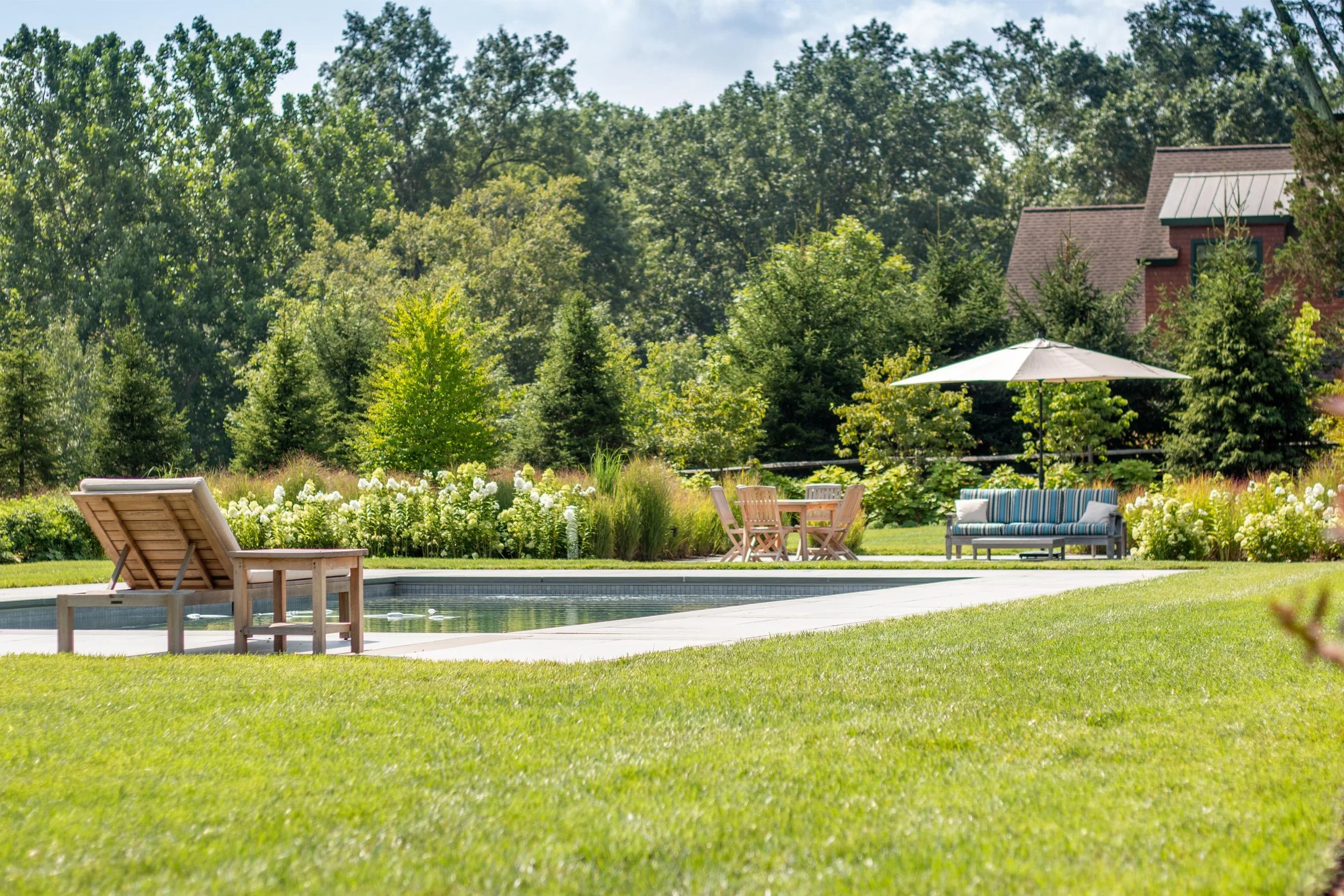 Paver patio and green lawn in Roxbury, NJ