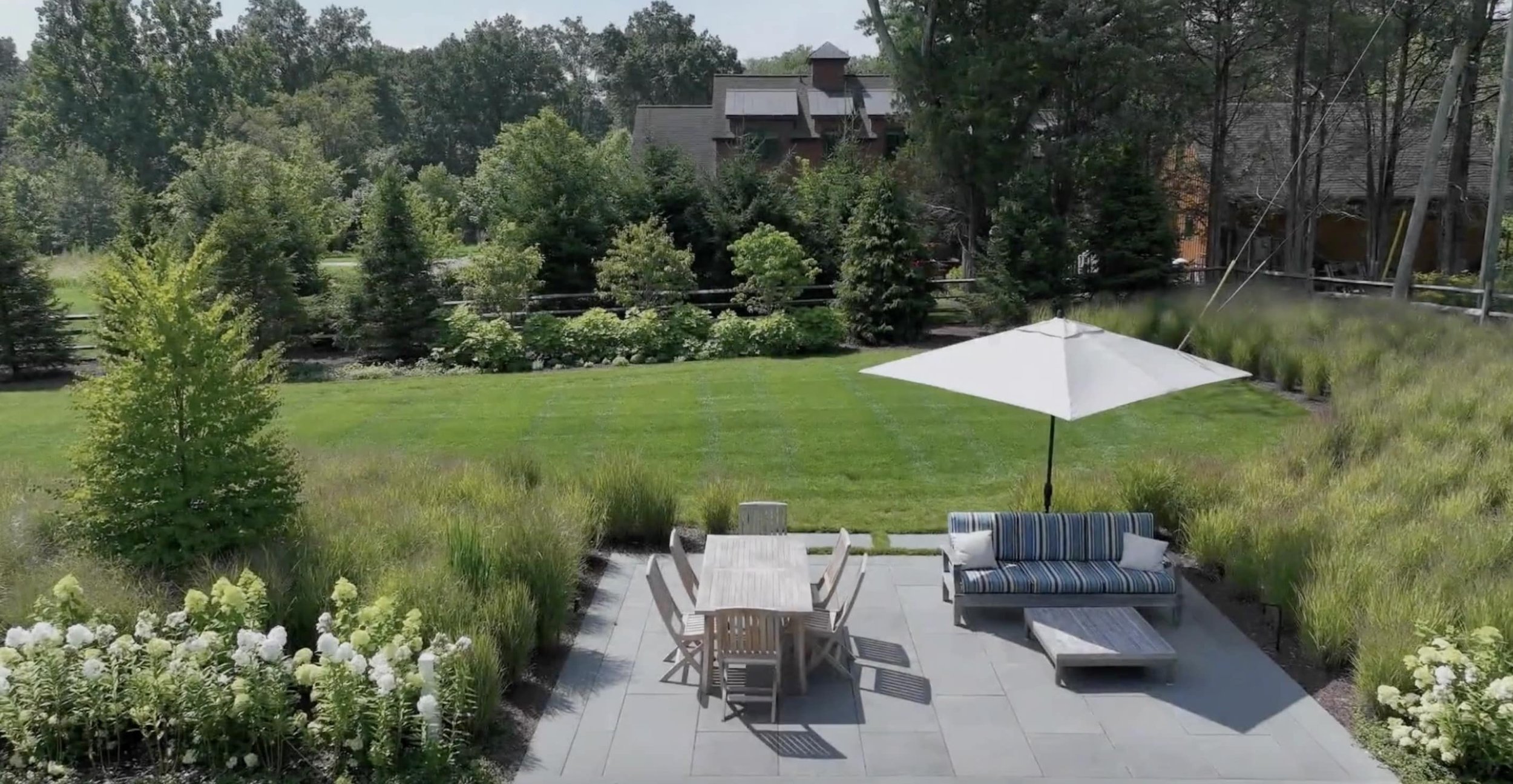 A beautiful backyard featuring stunning landscape design and fire pit in Mendham, NJ.jpg