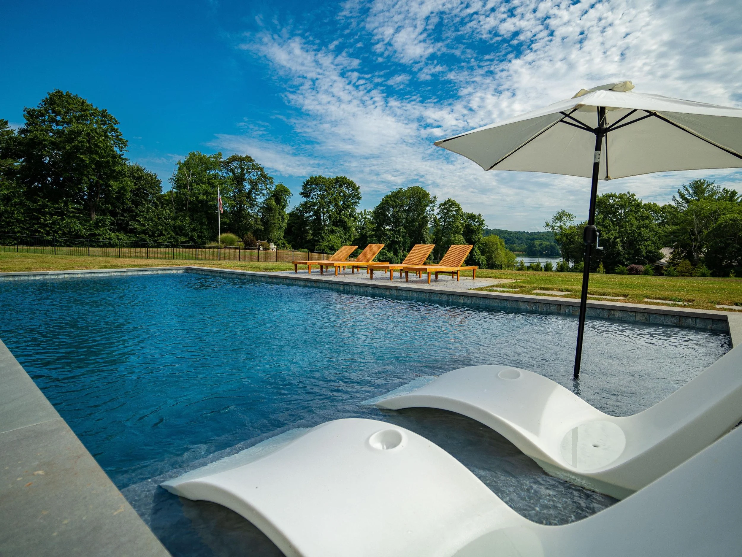 Custom inground pool and patio project by top pool company in Nashua, NH