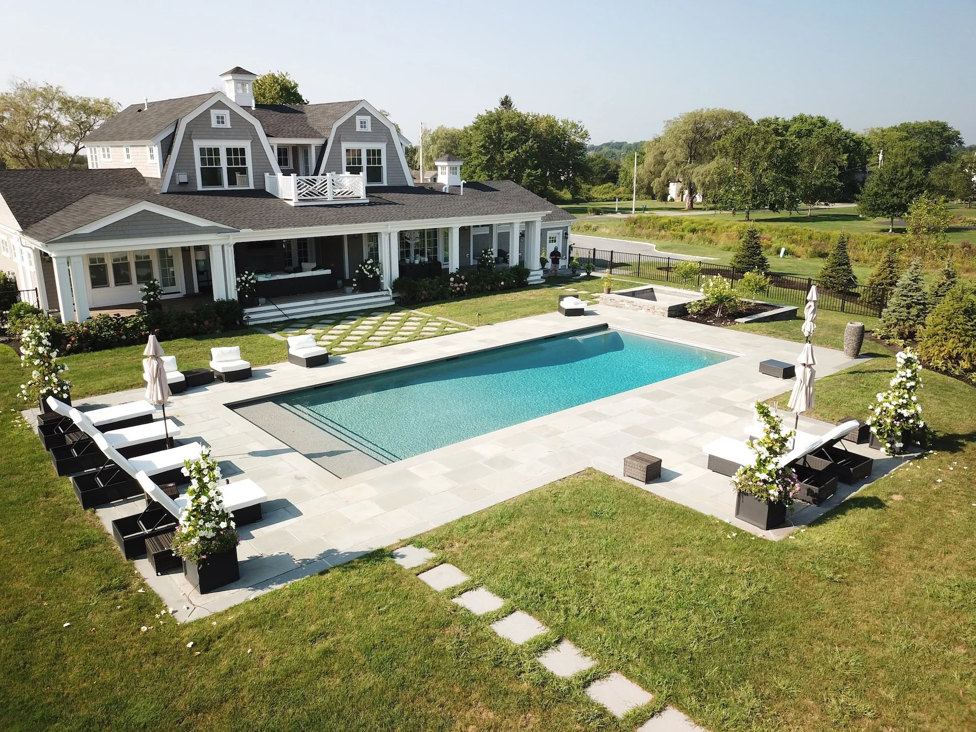 Luxury backyard poolscape and hardscaping in Nashua, NH