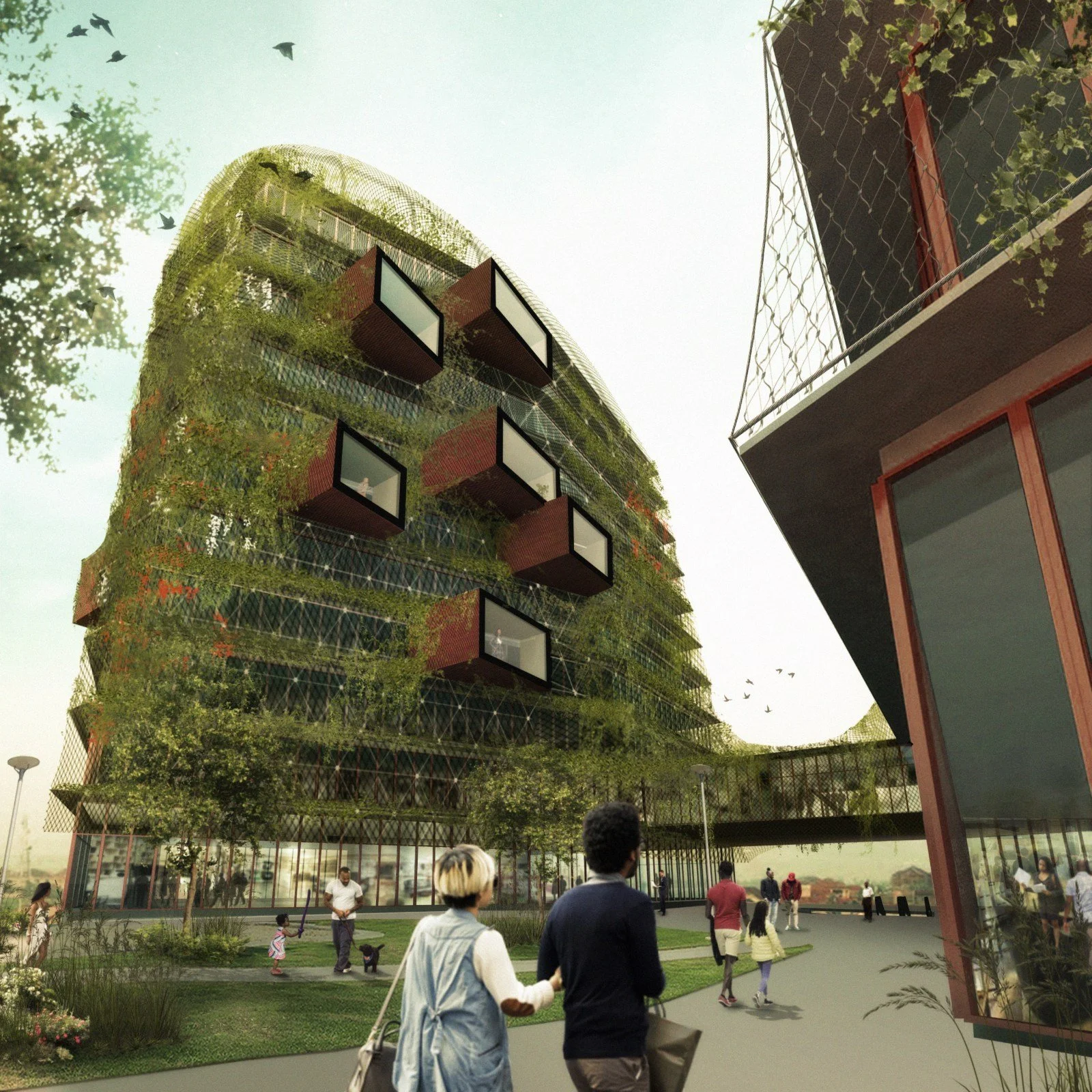 People walking and playing in a park area with modern multi-story buildings and trees in the background.
