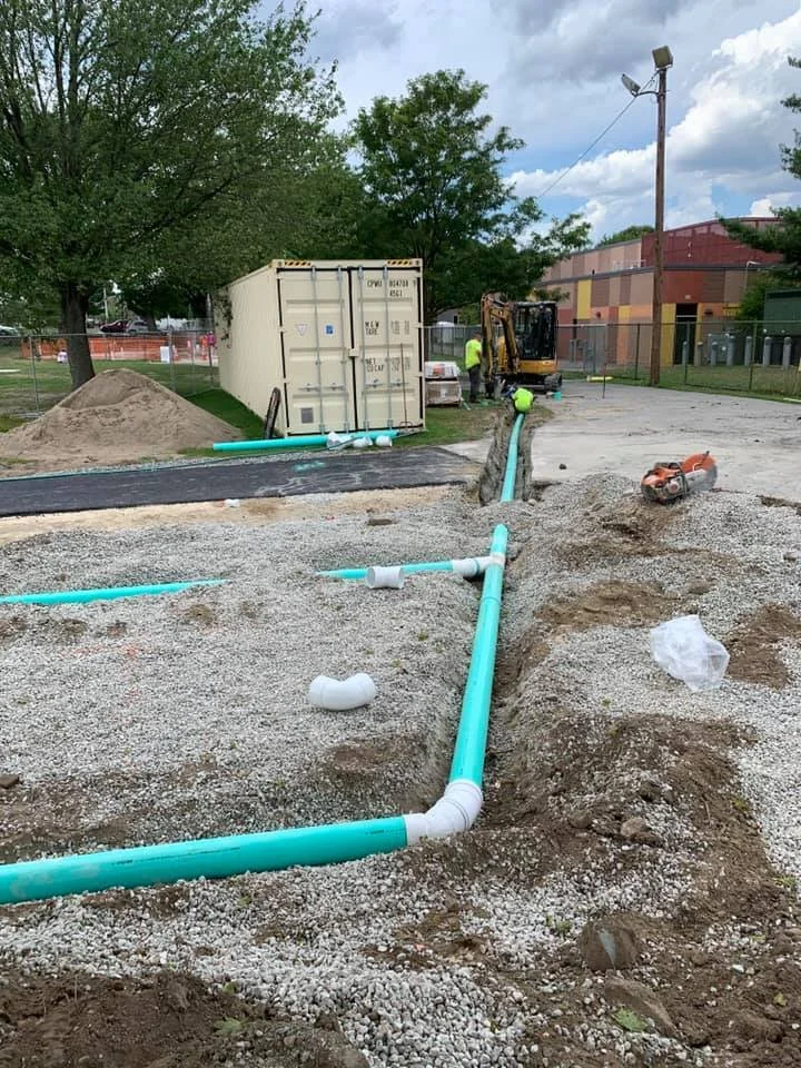 piping is laid for a new playground installation that is in progress 