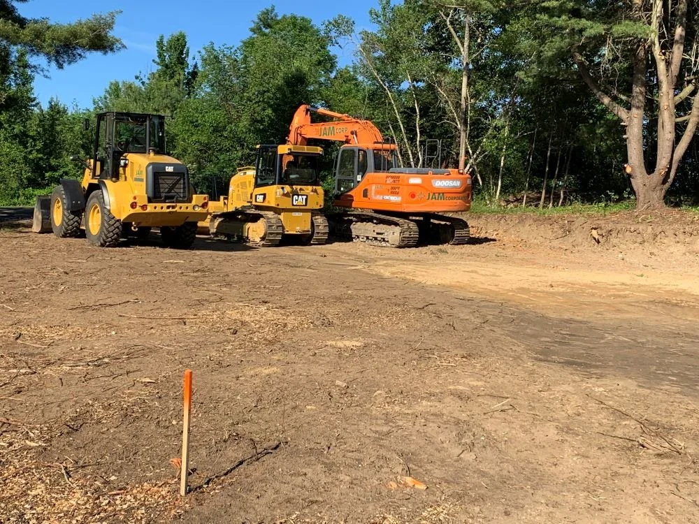 JAM Corporation's machines are onsite preparing the land for the Dog Park in South Hadley by levelling the ground.