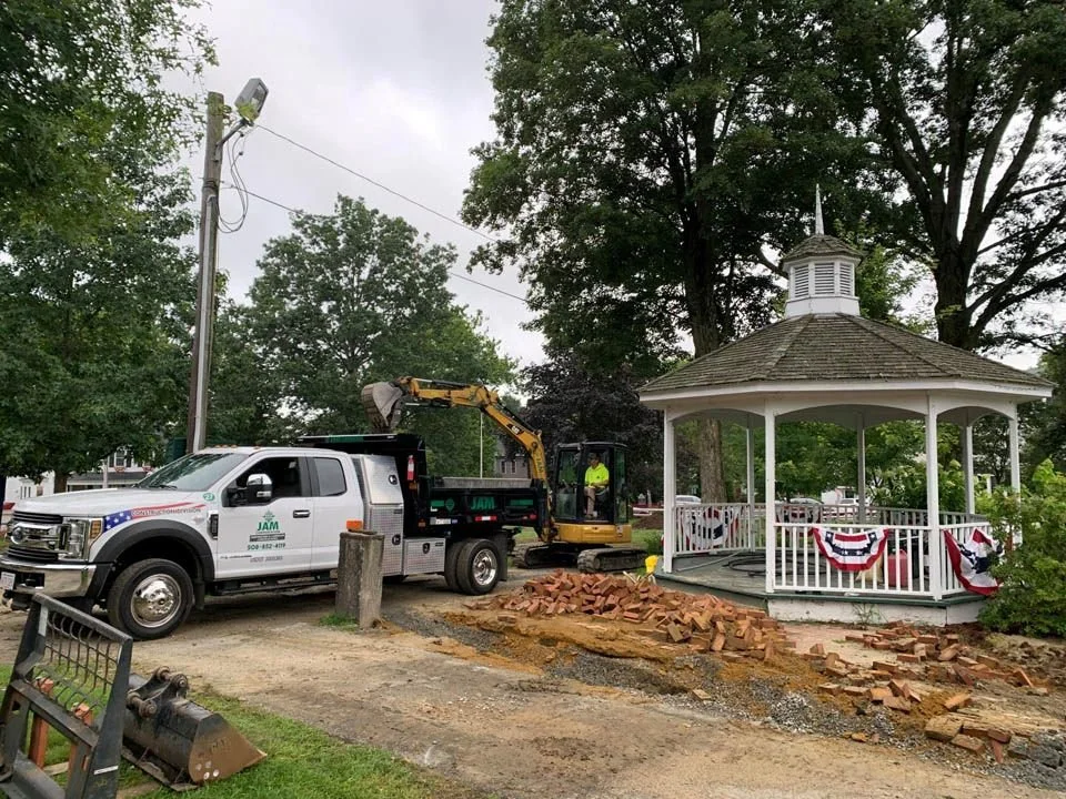 A JAM Corporation truck and machine are on the left with the new Grafton Commons gazebo on the right