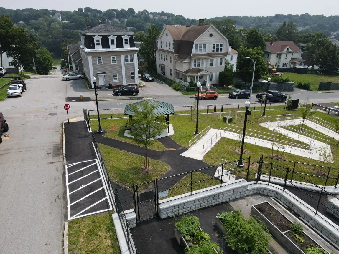 A zig zagging walkway and the entrance to the garden area of Worcester's Grant Square Community Garden.