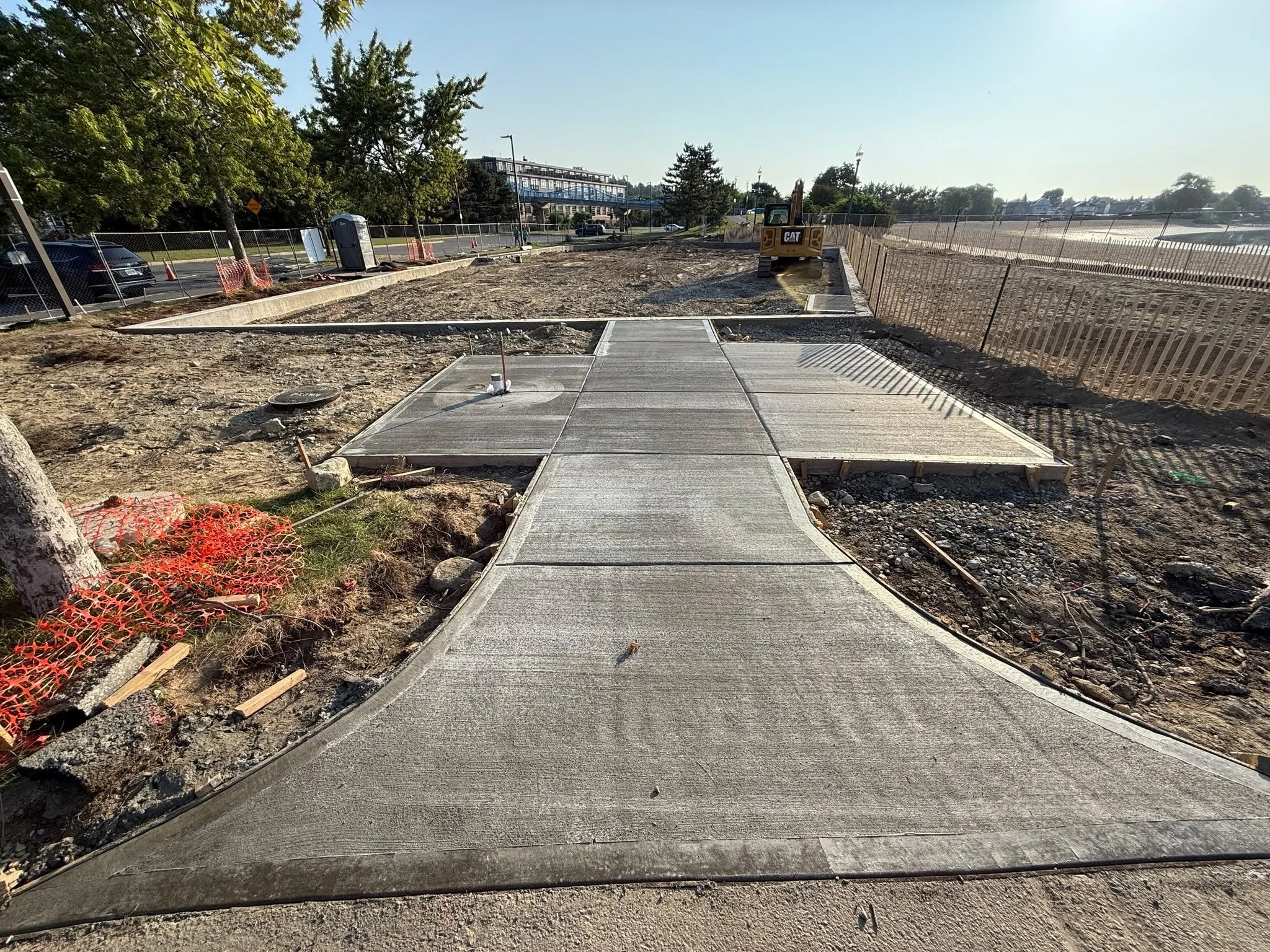 Progress at Constitution Beach Playground in Boston.  Crews are preparing for playground installation, All flatwork has been installed. The concrete pads will be used for the benches, water fountains, and bike racks.