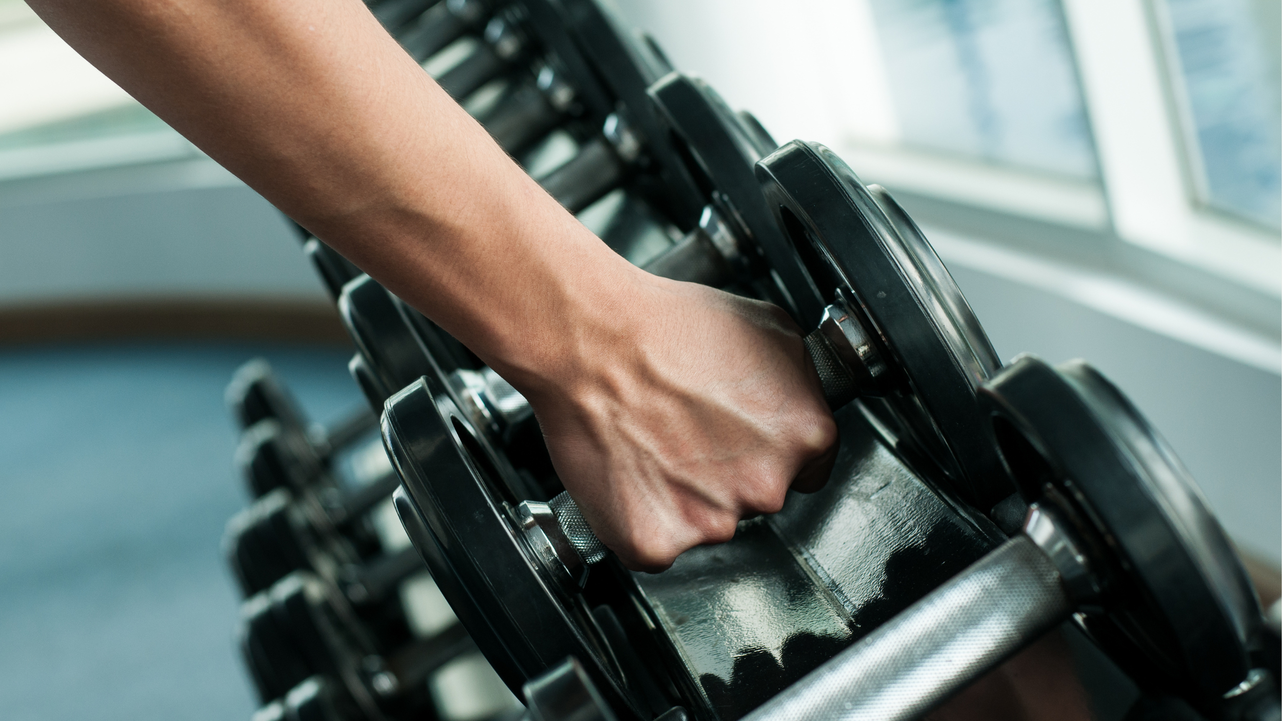 woman grabing weights